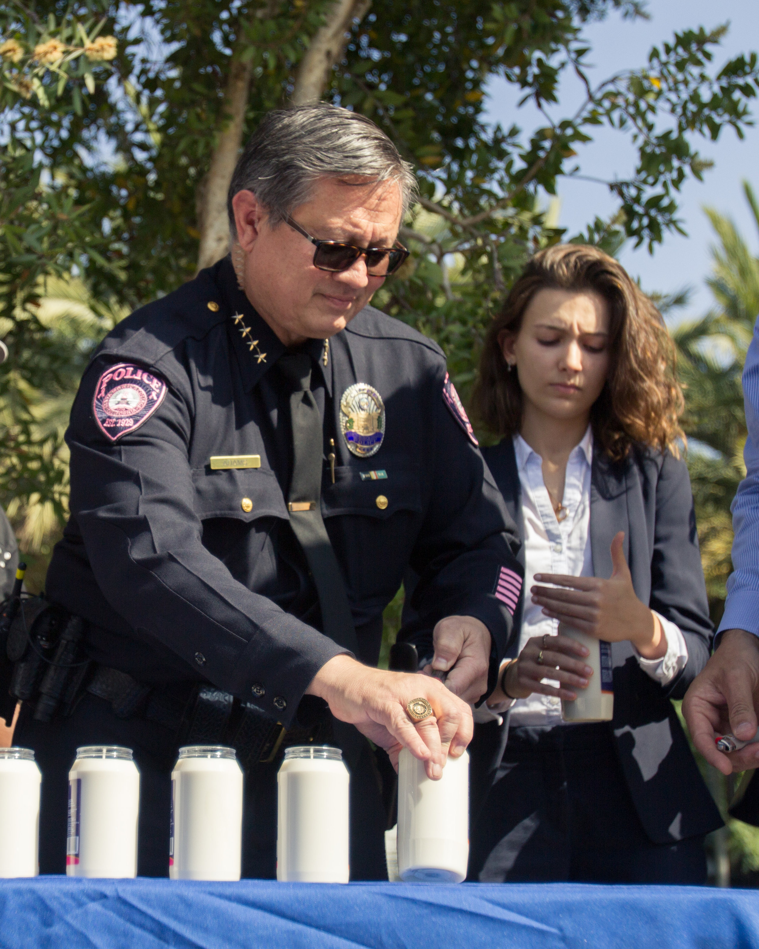  Chief of Police, Johnnie Adams (Left) lights his candle in honor of the Pittsburgh Synagogue shooting victims for the Vigil held at the Quad area in Santa Monica College in Santa Monica, California on Tuesday October 30th 2018. 