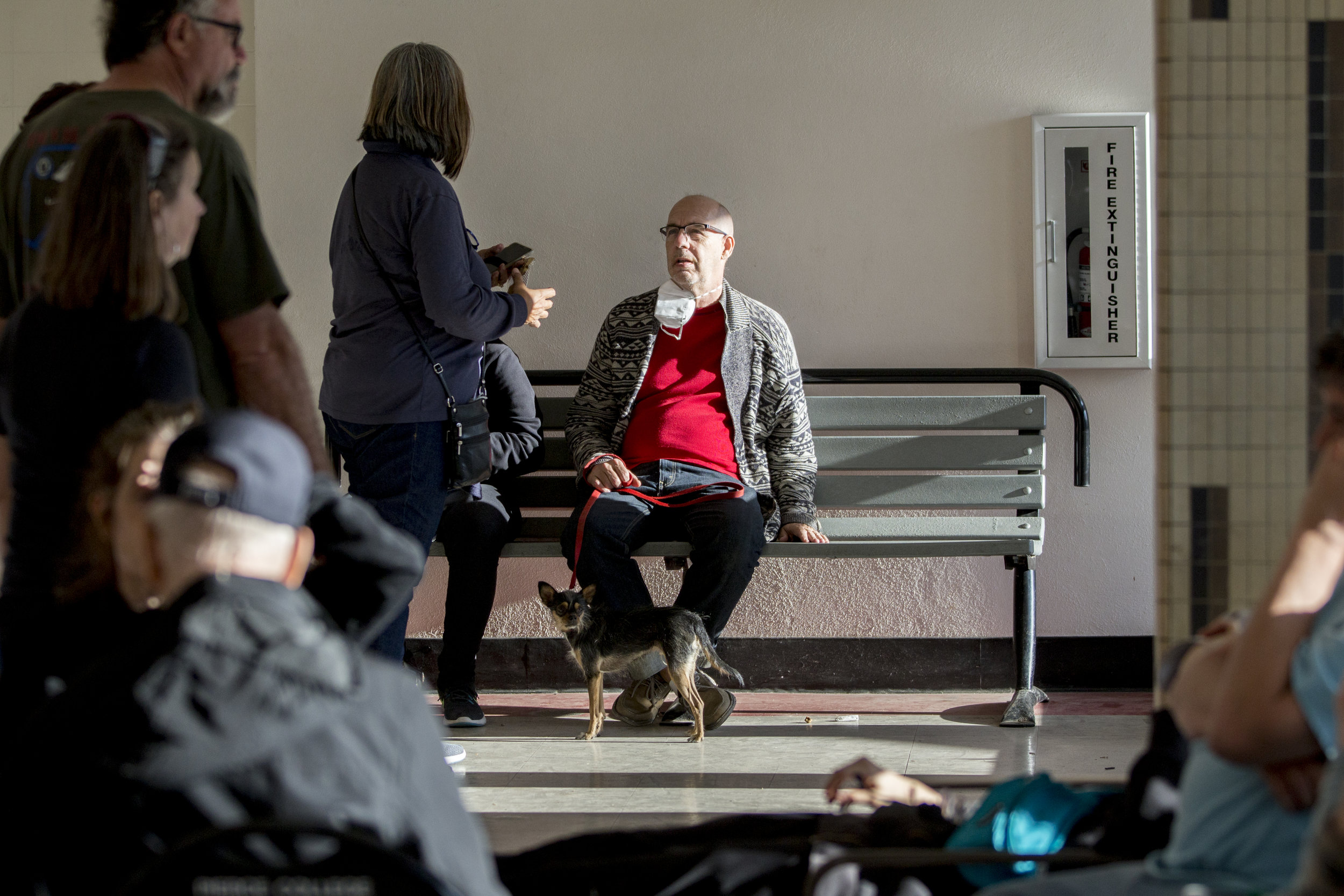  Scott Geske (center), from Oak Park, sits with his family and dog, Jasper, at the Woolsey fire evacuation center set up at Los Angeles Pierce College on November 9, 2018 in Woodland Hills, Calif. 

Geske reflected on how they moved into the neighbor