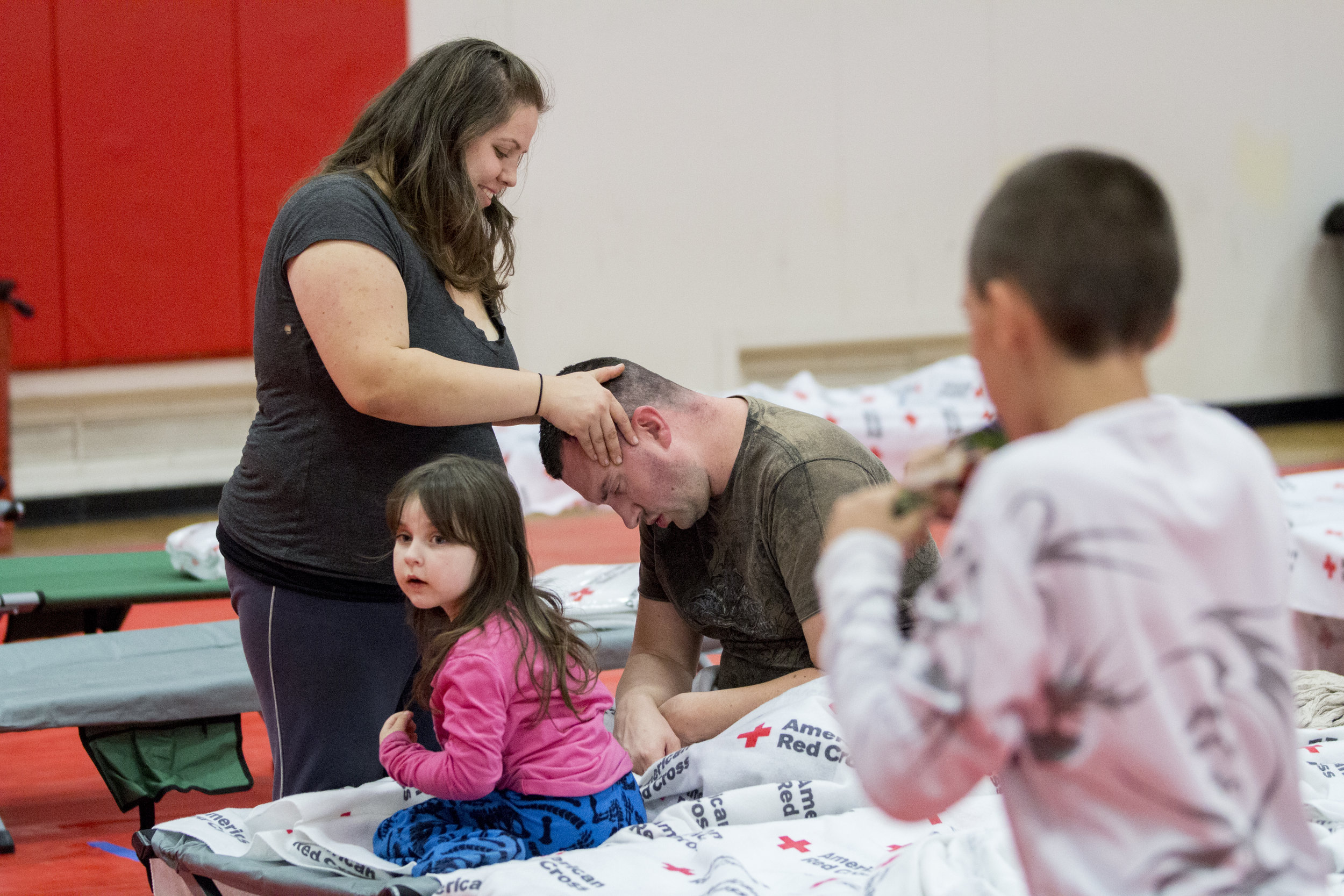  An evacuee cares for her husband and family at the Woolsey fire evacuation center set up at Los Angeles Pierce College on November 9, 2018 in Woodland Hills, Calif. (Jose Lopez) 