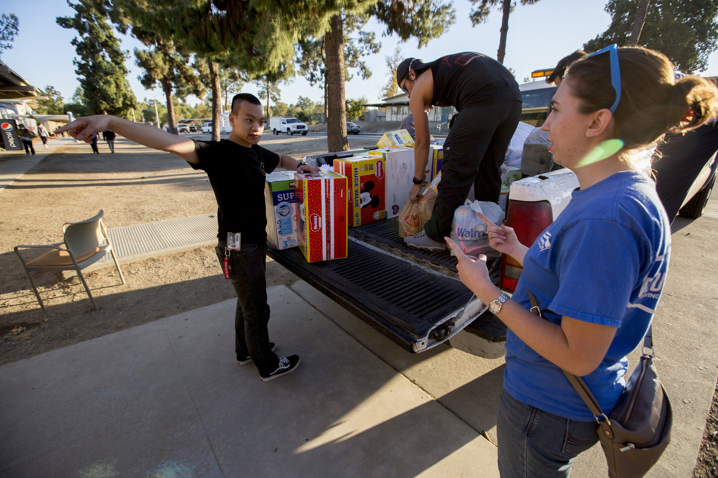 Volunteers unload supplies to help care for evacuees at the Woolsey fire evacuation center set up at Los Angeles Pierce College on November 9, 2018 in Woodland Hills, Calif. (Jose Lopez) 