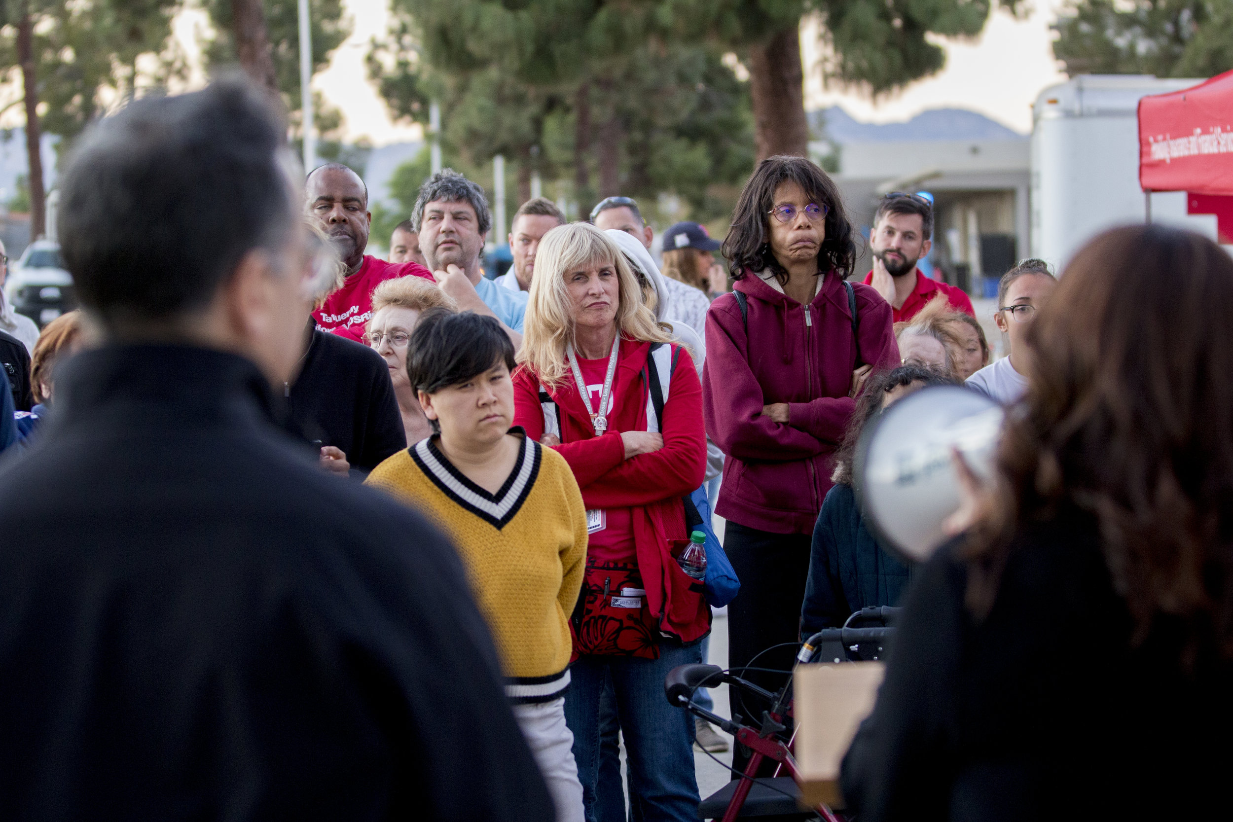  Evacuees listen as authorities share updates on the Woolsey fire in front of the evacuation center set up at Los Angeles Pierce College on November 9, 2018 in Woodland Hills, Calif. (Jose Lopez) 