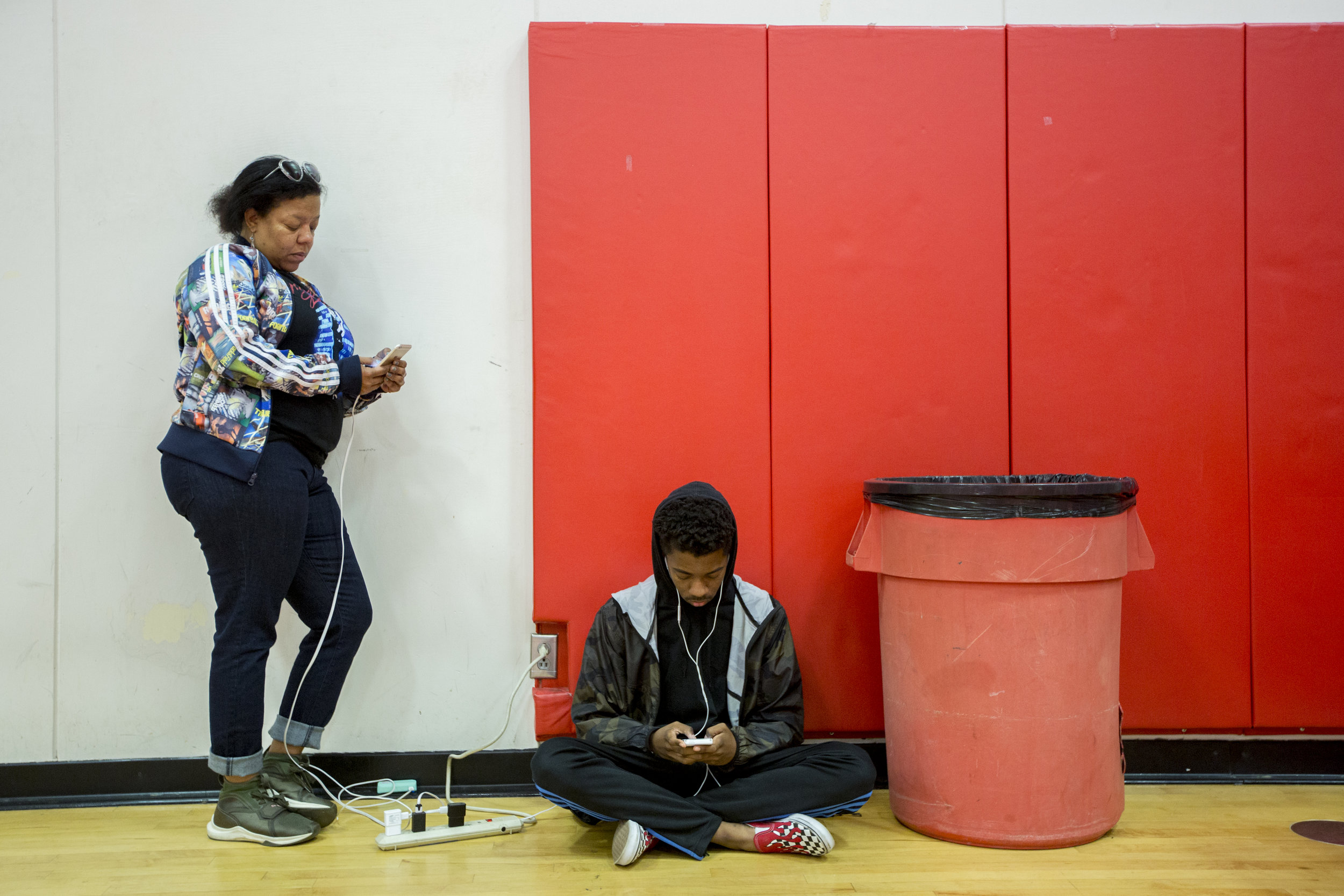  Jenyce Johnson and her son, from Thousand Oaks, charge their phones and stay connected at the Woolsey fire evacuation center set up at Los Angeles Pierce College on November 9, 2018 in Woodland Hills, Calif. Already shaken by the Borderline Bar &amp