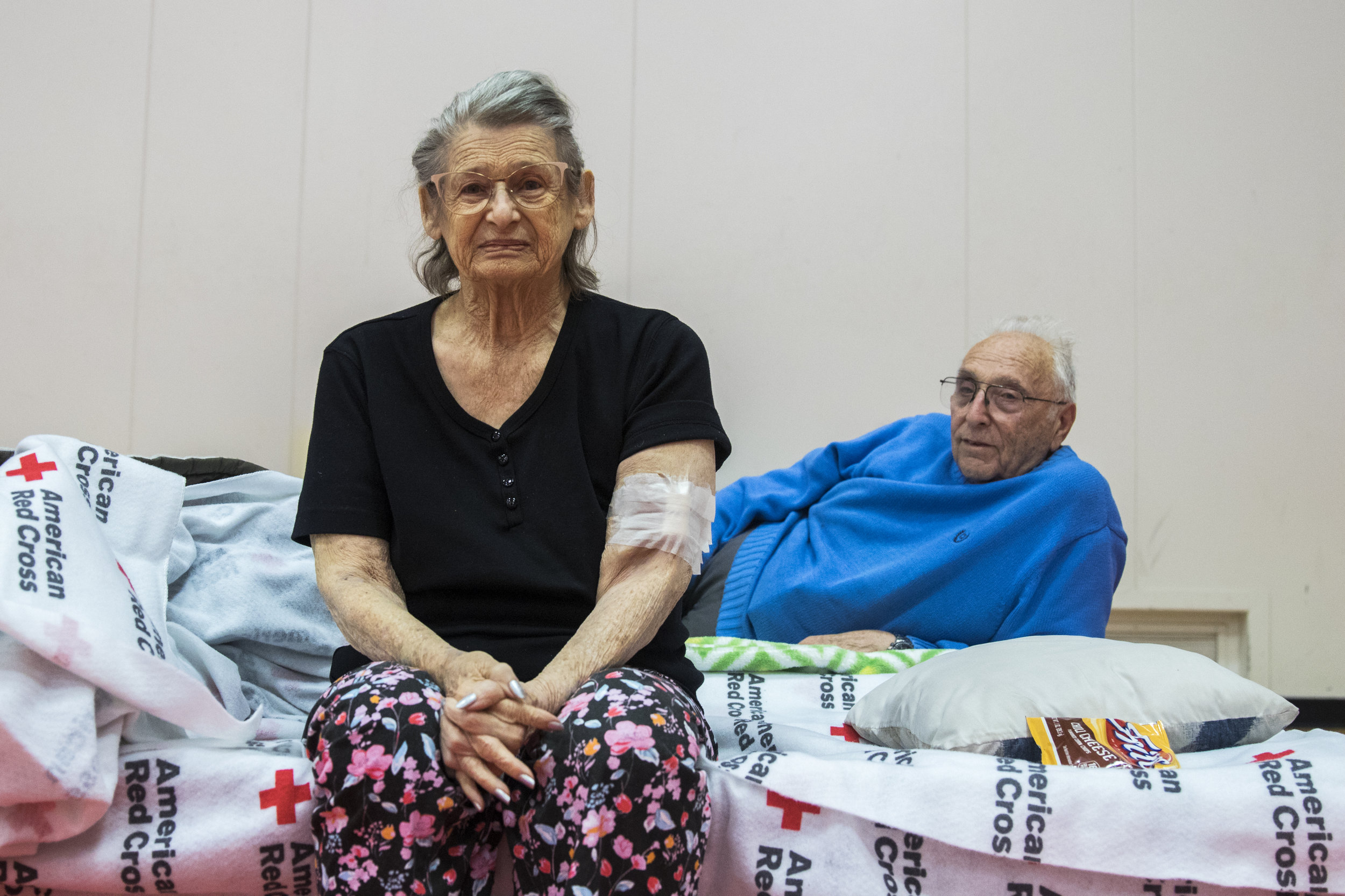  Penny Stark (left) and Ron Stark (right) relax at an evacuation center located at Pierce College in Woodland Hills, California on November 9, 2018 after evacuating their home in Oak Park, California the night before. The started their evacuation wit