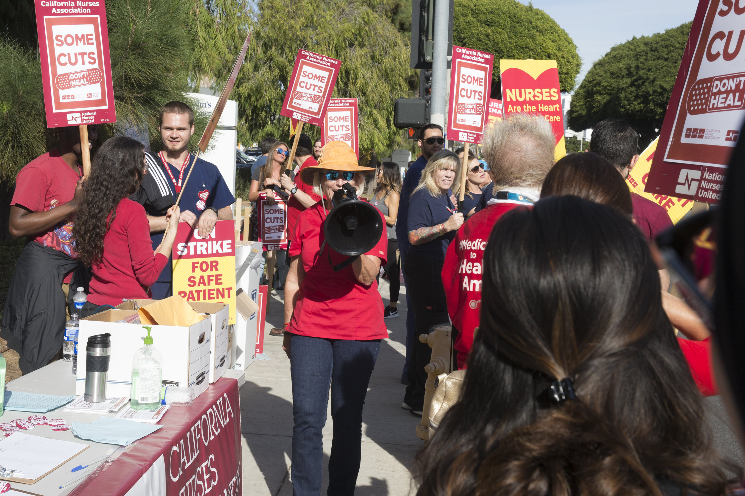  Sudie Cannone (middle), a registered Nurse and member of the California Nurses Association  chants "Nurses on the outside, trouble on the inside!" at a Nurses Strike outside of Providence Saint Johns Health Center in Santa Monica, California on Nove