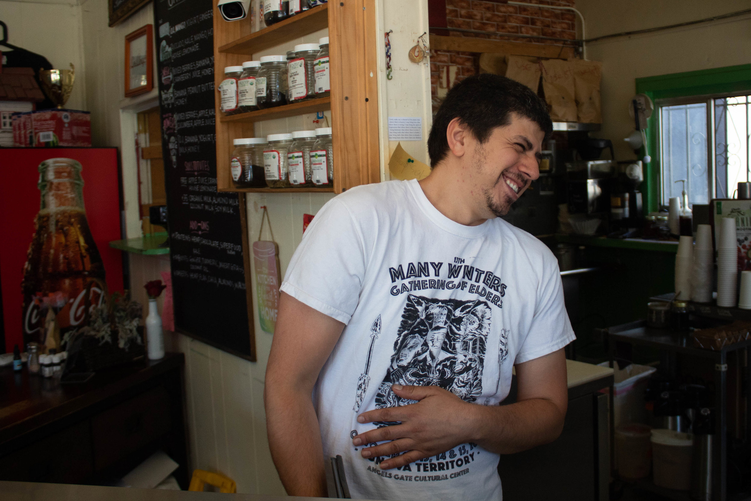  Sam Mala, The owner of UnUrban Coffee House, smiles from the wide doorway to the kitchen on April 18, 2019, Santa Monica, California. Danica Creahan / The Corsair 