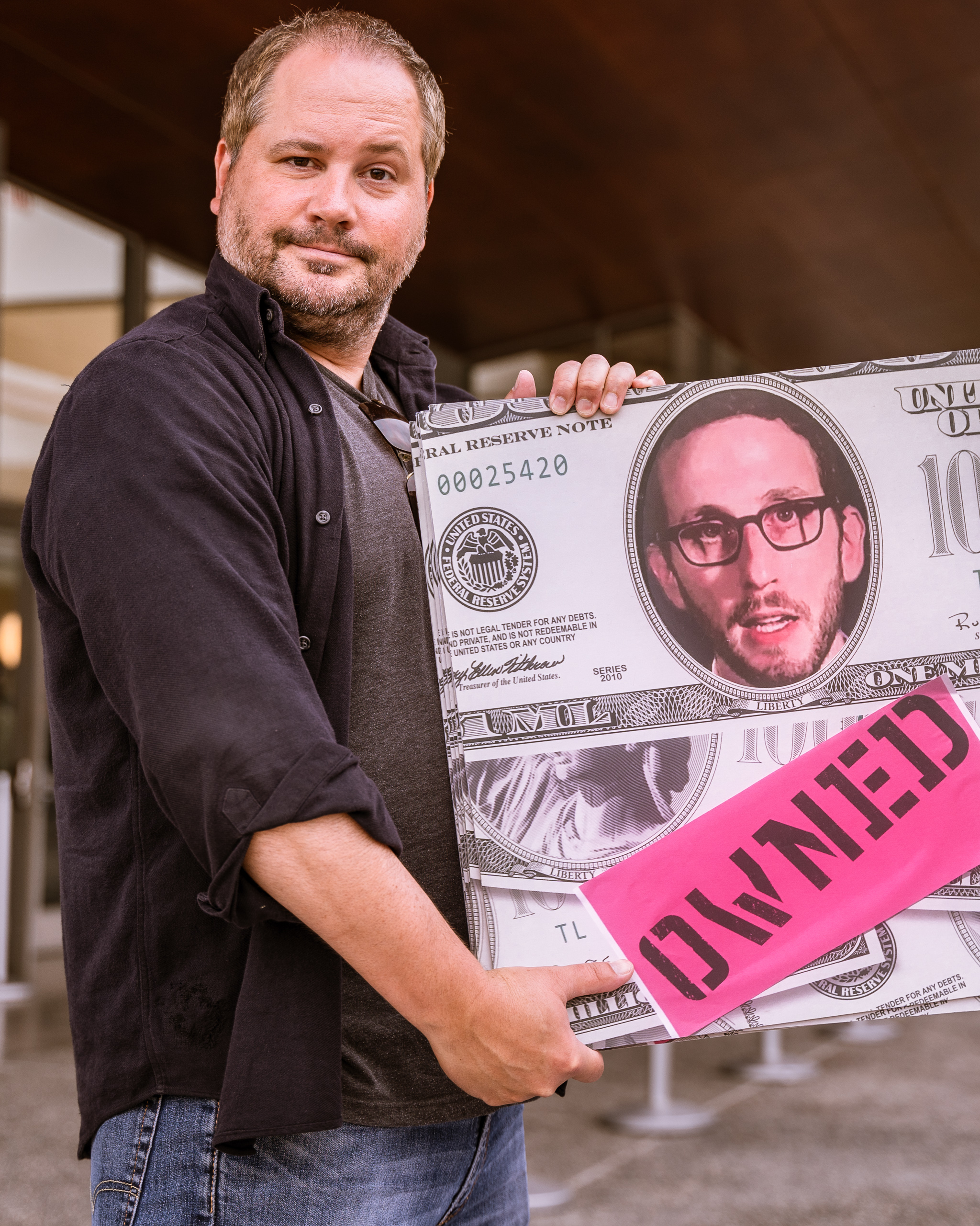 Lawyer and journalist Chris Legras of Santa Monica holds a sign questioning the motives of California State Senator Scott Weiner's (SD11 – San Francisco) SB 50 which proposes new approaches to California’s housing issues, outside the the Broad Stage at the SMC Performing Arts Center on Thursday, May 9, 2019. Legras said, "I worry about SB-50, it's a poorly planned, rushed solution to a problem we all know exists. It's going to effect the poor and marginalized the most." The SMC Public Policy Institute is presenting its 8th Annual Spring Symposium, "There Goes the Neighborhood, Part II: How might policy approaches prevent displacement in neighborhoods affected by gentrification?" from May 4-9. Tonight's final event in the series is "Where Goes the Road to Solving California’s Housing Crisis? A Keynote Discussion with Legislative Leaders." The panel includes California state legislators Senator Ben Allen (SD26 – Santa Monica) and Senator Scott Weiner (SD11 – San Francisco), author of SB 50 which proposes bold approaches to California’s housing issues, and Santa Monica Mayor Gleam Davis, a former Co-Chair of Santa Monicans for Renters’ Rights and leading advocate for Santa Monica’s innovative policy solutions and funding for affordable housing." (Glenn Zucman/The Corsair)