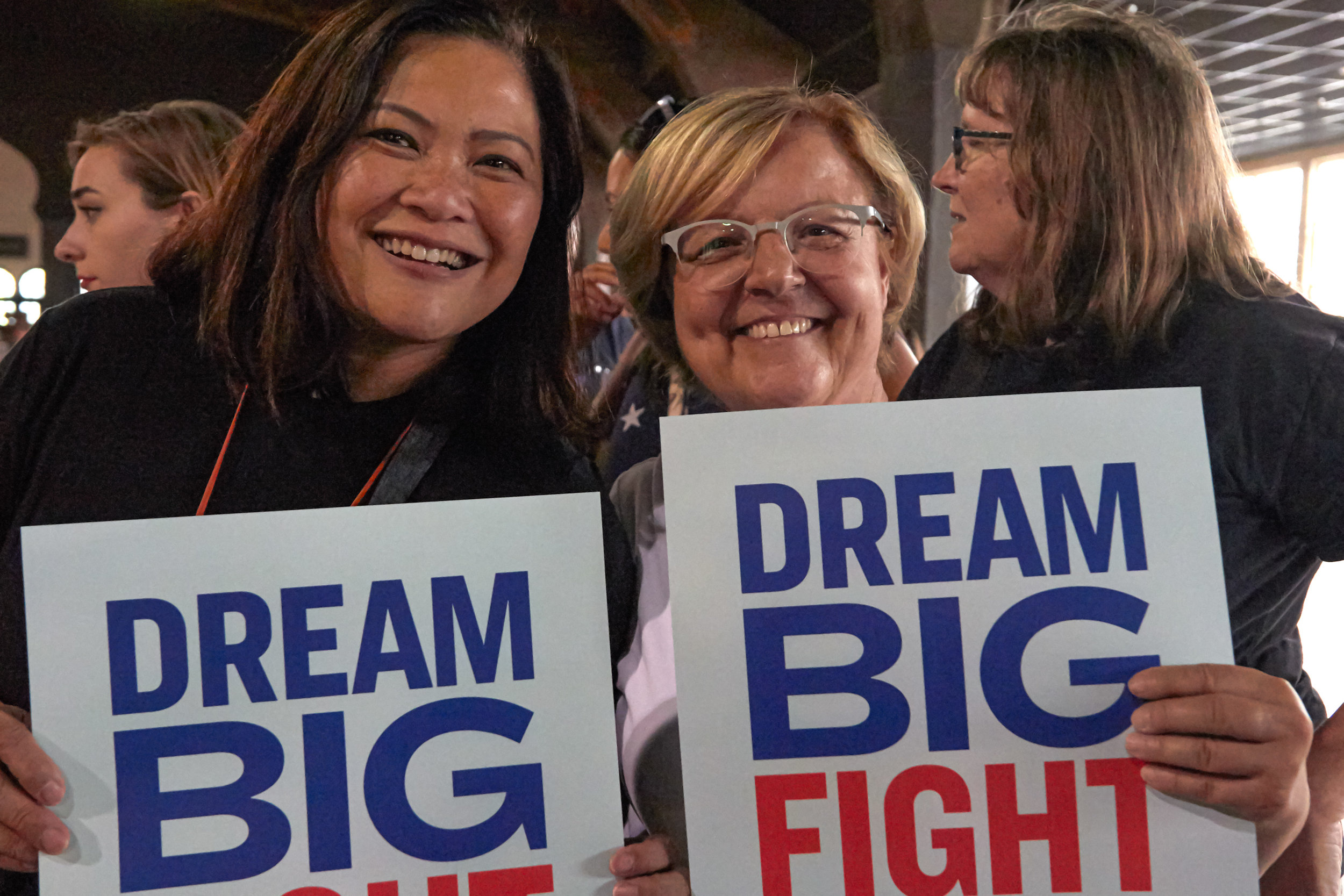  Mimi Roces (left), and Carolyn Casavan, of Long Beach, California, hold signs before a Town Hall event for Elizabeth Warren's presidential campaign, at the Shrine Expo Hall, Los Angeles, California, on August 21st 2019. (Marco Pallotti/The Corsair) 