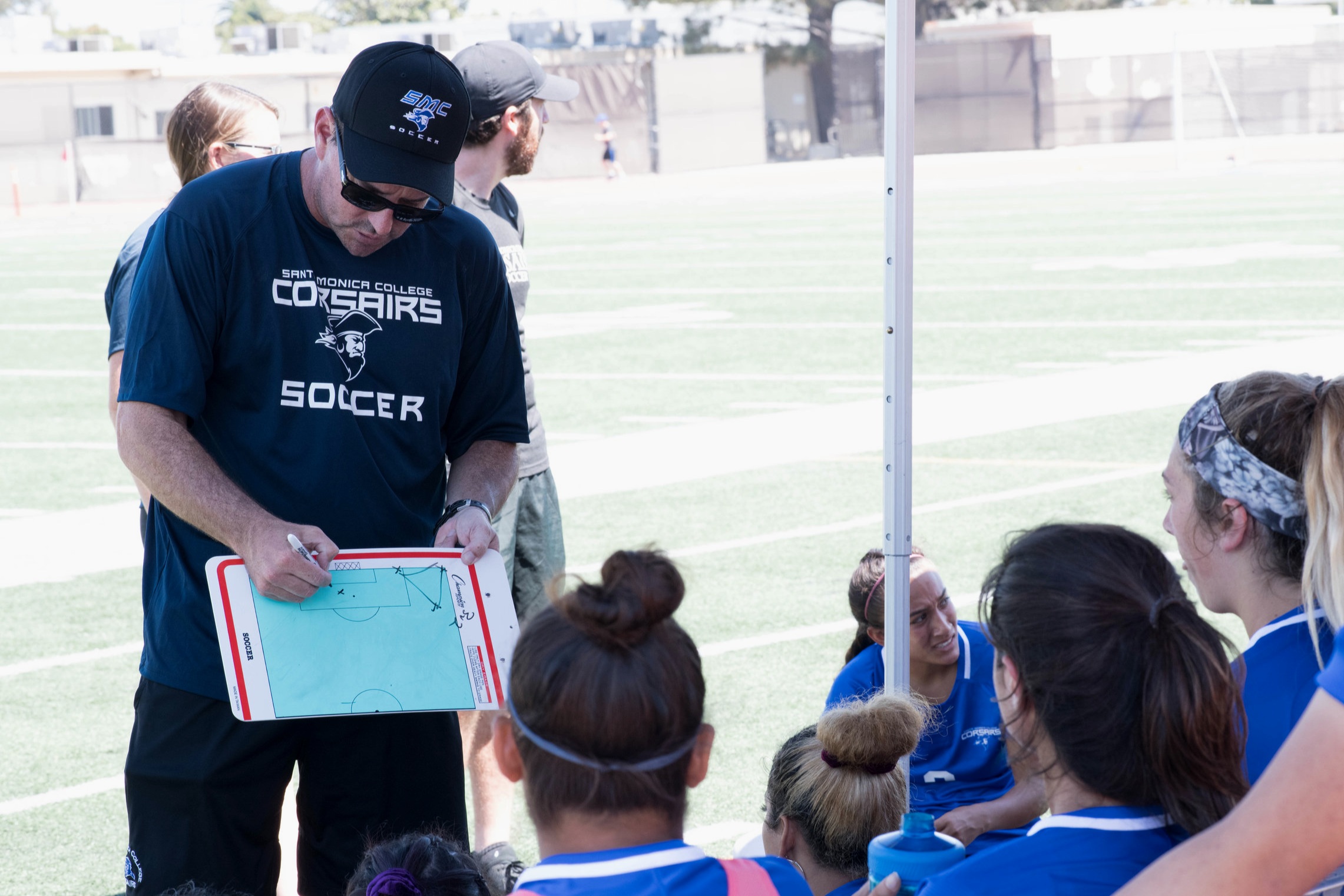  Head Coach Aaron Benditson showing his team the game plan.(Photo By Kevin Tidmore/Caption By Deshawn Pouper/The Corsair) 