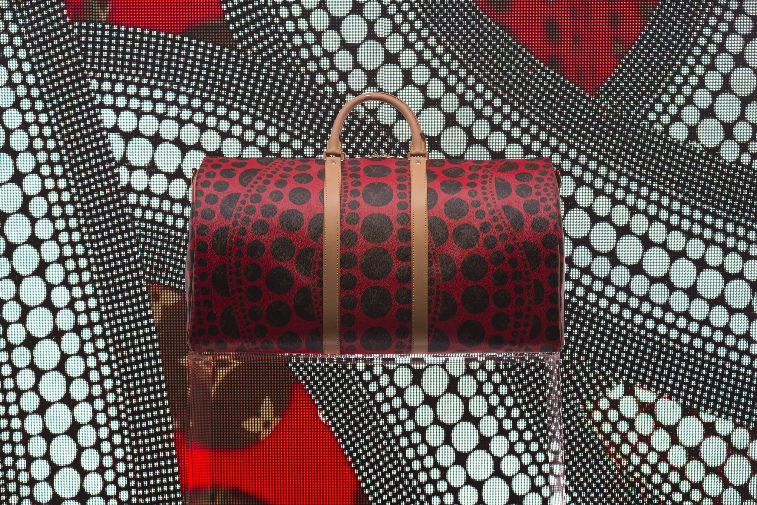  Louis Vuitton collaborated with Japanese artist Yayoi Kusama to create this one of a kind designer Keepall bag. Yayoi Kusama is well-known for her eccentric dots in her artwork due to her symptoms from bipolar disorder.  (Anthony Mayan/The Corsair) 