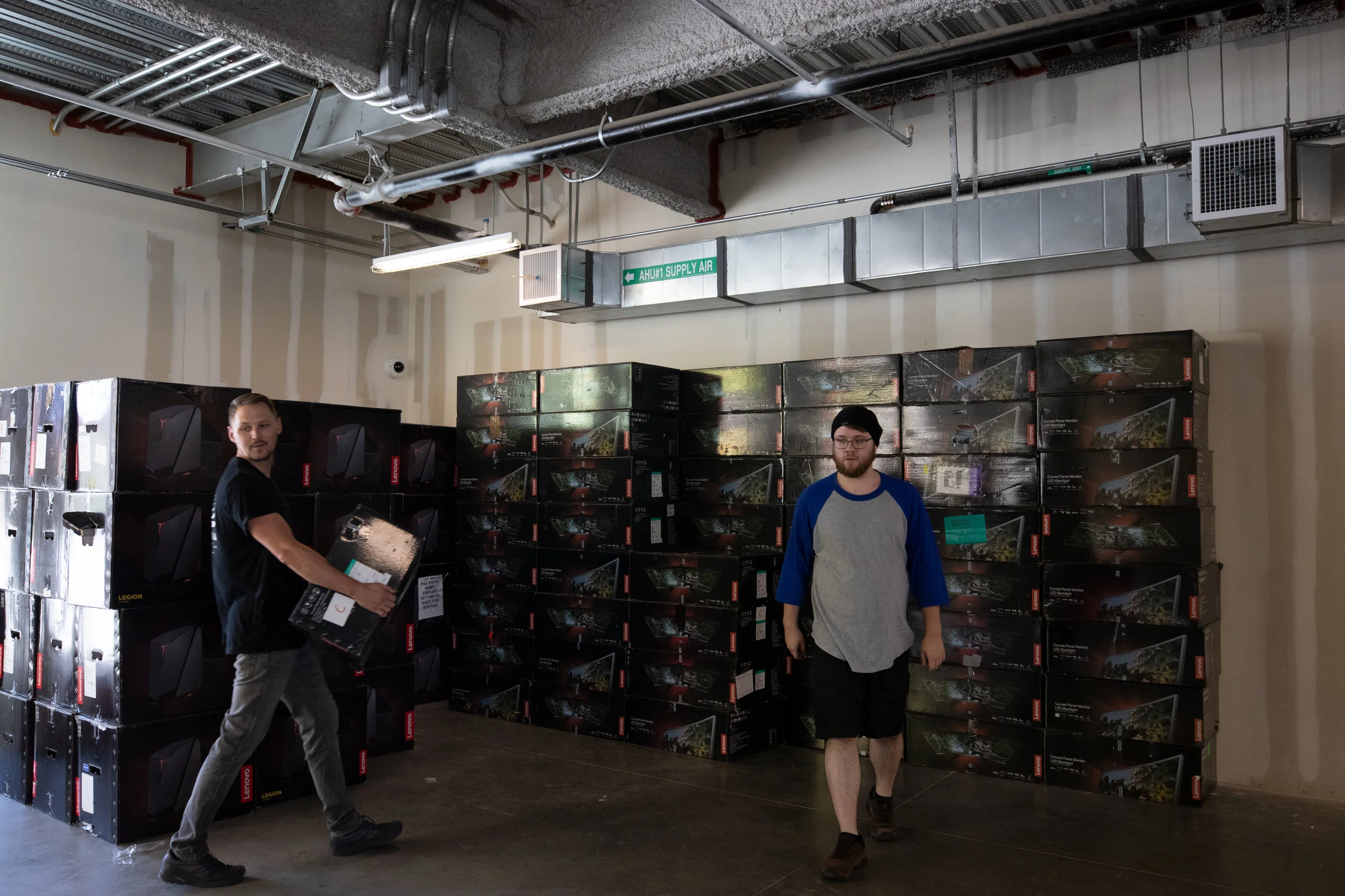 Volunteers bringing in PCs and Monitors getting ready for the 2019 IndieCade held at the Center for Media and Design campus of Santa Monica College. In Santa Monica,California. Oct. 8, 2019