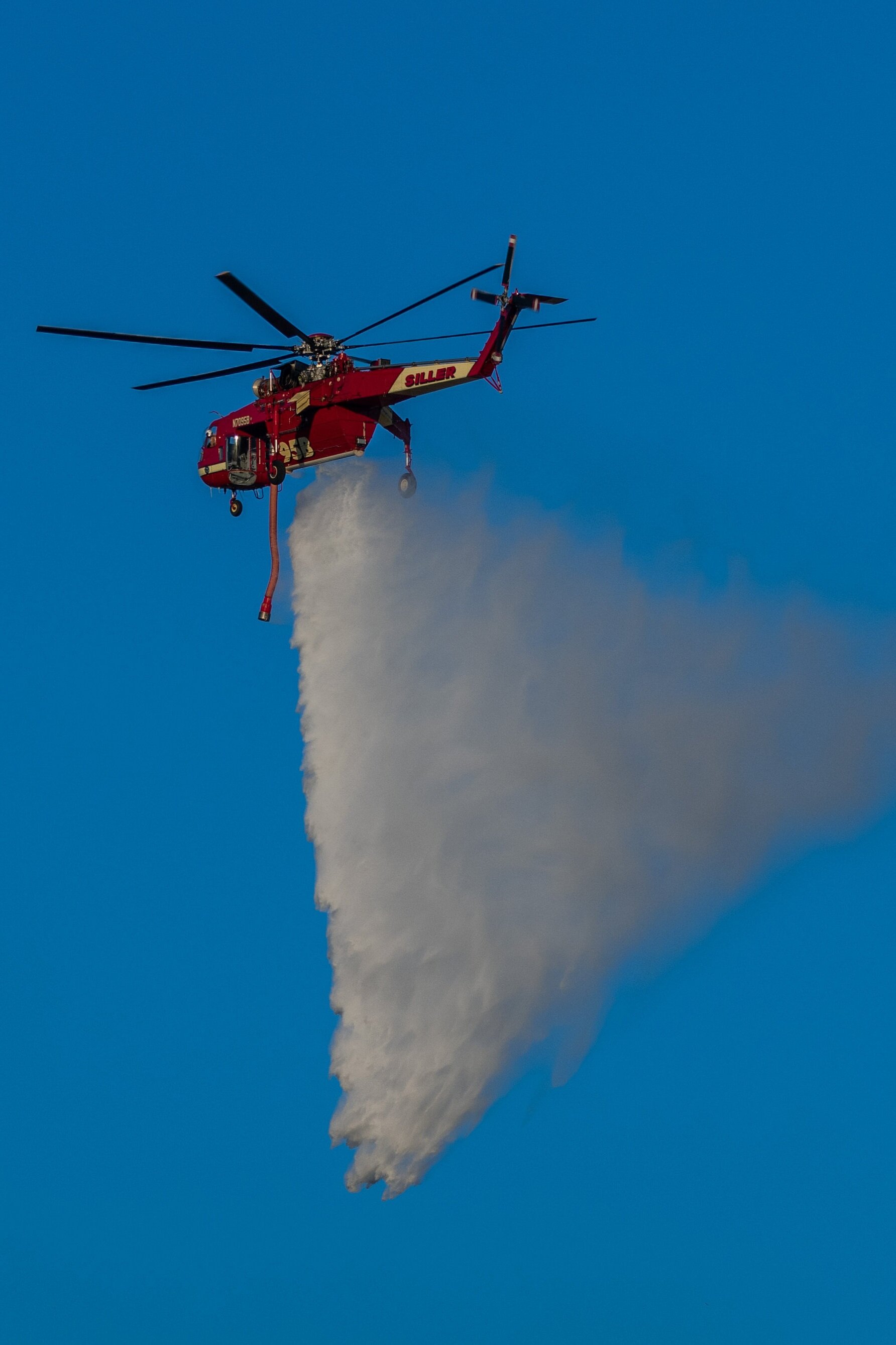  A helitanker dropping water on a part of the Saddlerige Fire near Newhall Calif. on Friday, Oct. 11, 2019. (Conner Savage/The Corsair) 