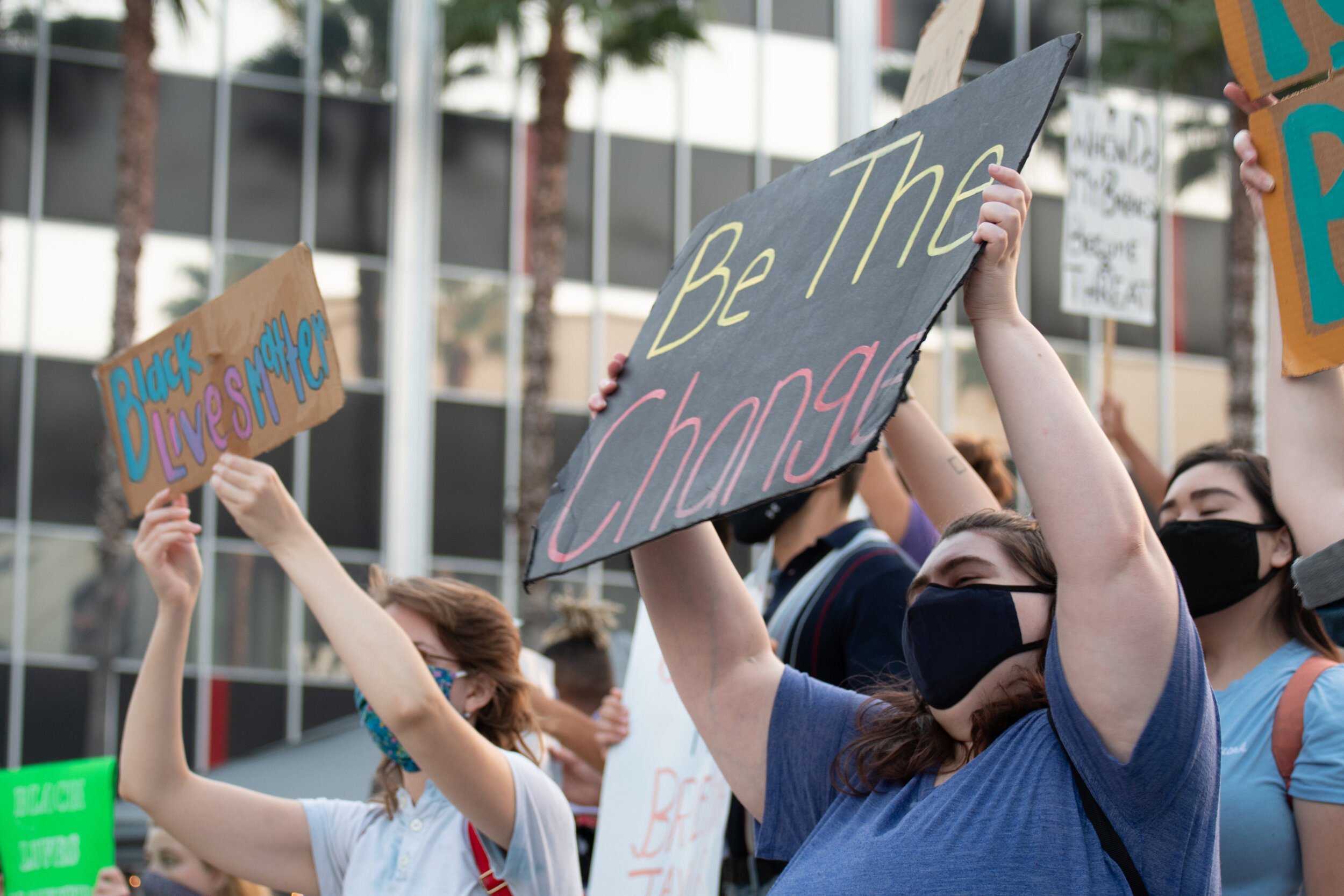   Protesters with The Valley of Change hold up signs at the Sherman Oaks Galleria on Sepulveda Blvd and Ventura Blvd in Sherman Oaks, Calif. on Saturday, Sept. 26, 2020. (Michael Goldsmith / The Corsair)  