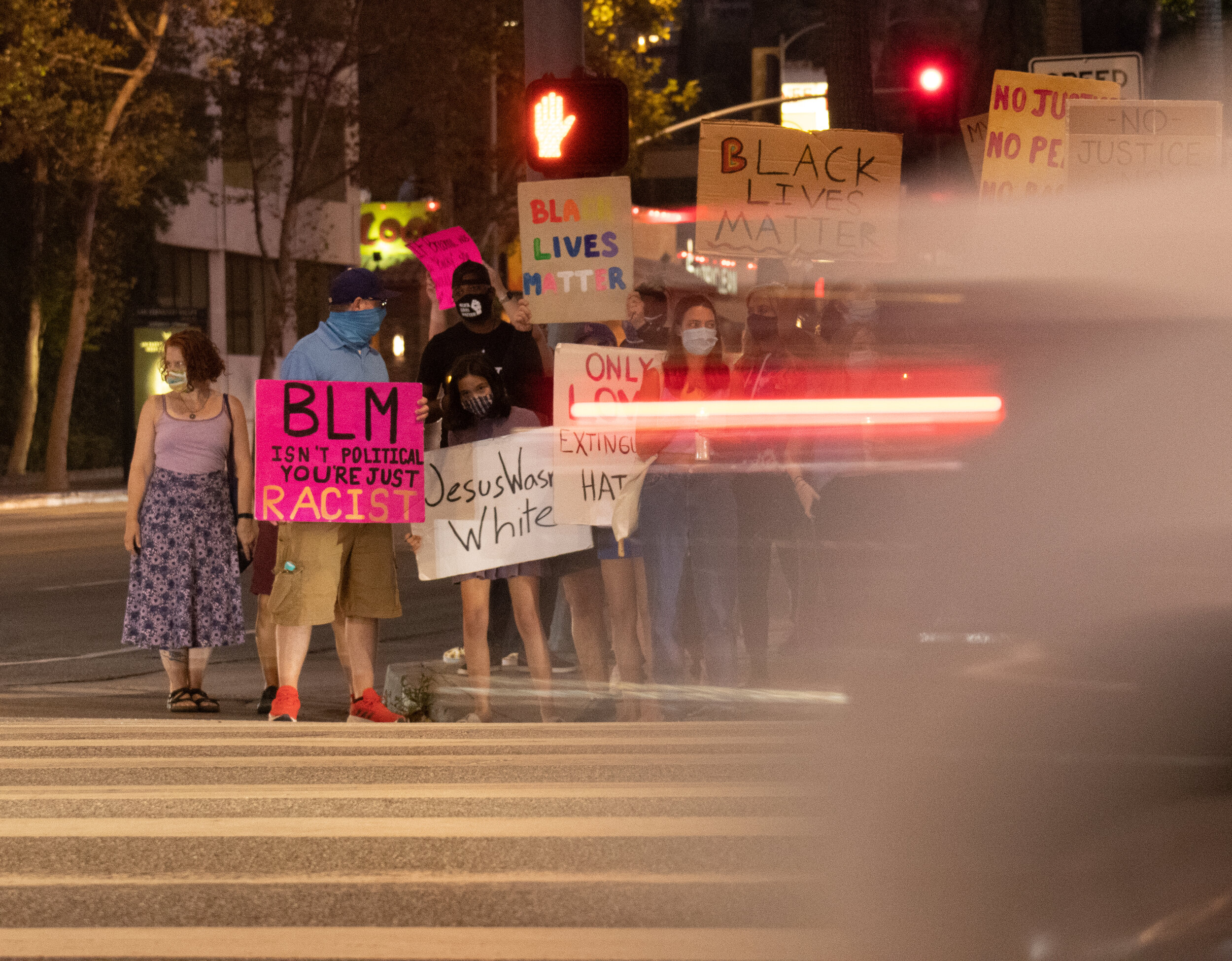   Protesters with The Valley of Change stand outside the Sherman Oaks Galleria at the southwest corner of Sepulveda Blvd and Ventura Blvd in Sherman Oaks, Calif. The Saturday, Sept. 26, 2020, Candlelight Vigil for Breonna Taylor brought together doze