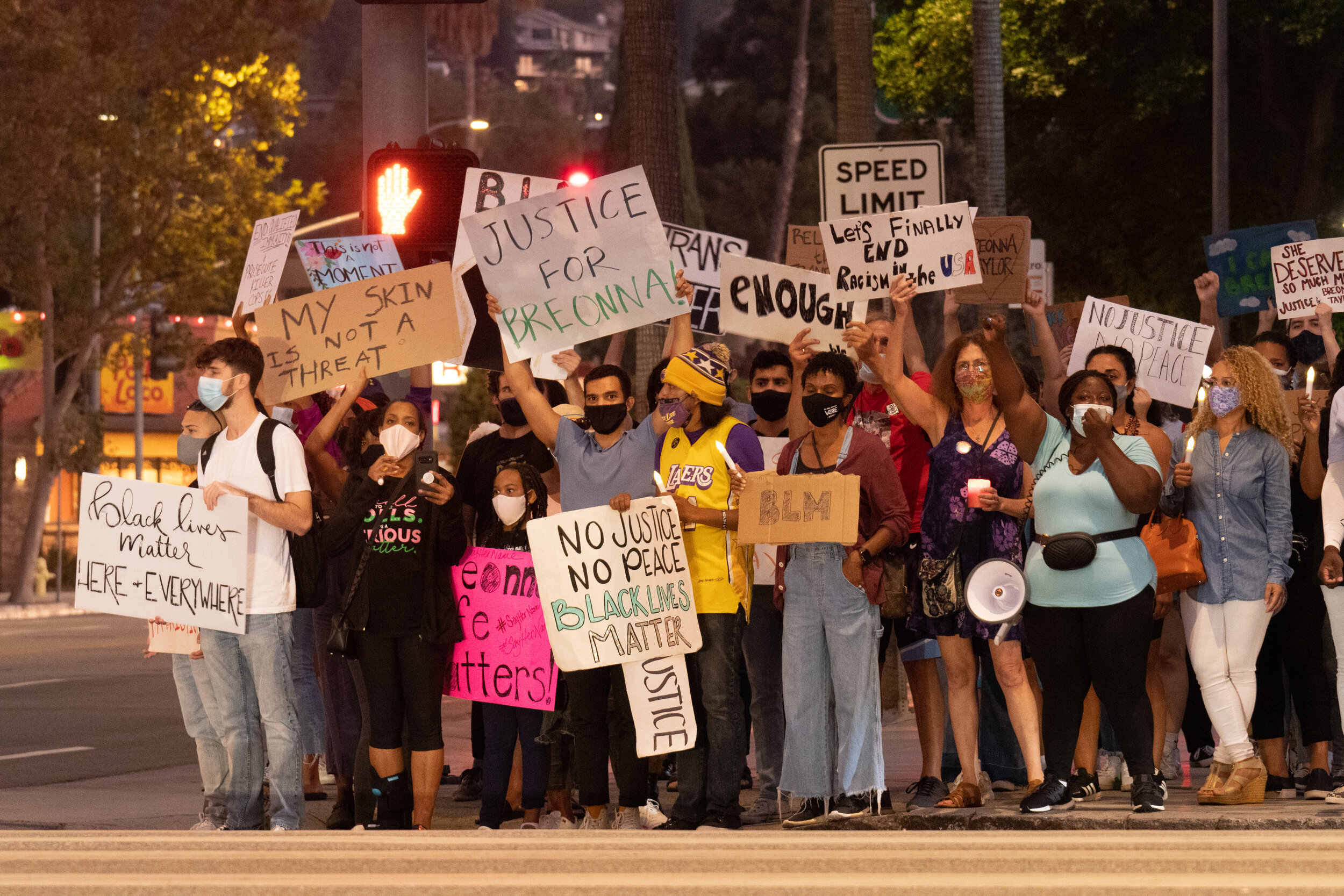   Protesters with The Valley of Change stand on the corner of Sepulveda Blvd and Ventura Blvd in Sherman Oaks, Calif. on Sept. 26, 2020. (Michael Goldsmith / The Corsair)  