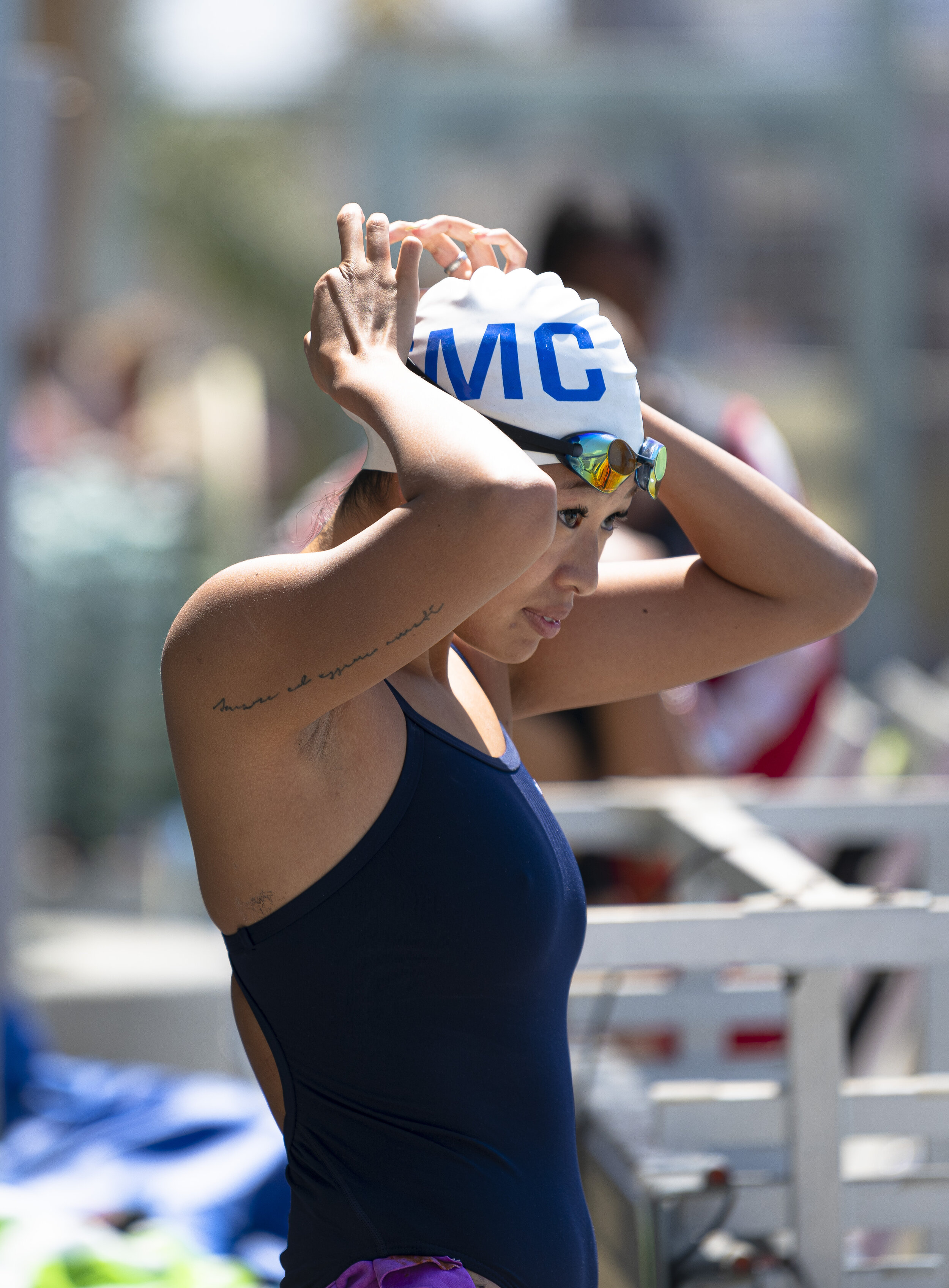  Risa Akatsu prepares her goggles for the meet with Bakersfieldd college on April 16, 2021, in Santa Monica Calif. After being forced to shutdown for nearly a year from the COVID-19 pandemic, the sports programs such as the swim team and other non-co