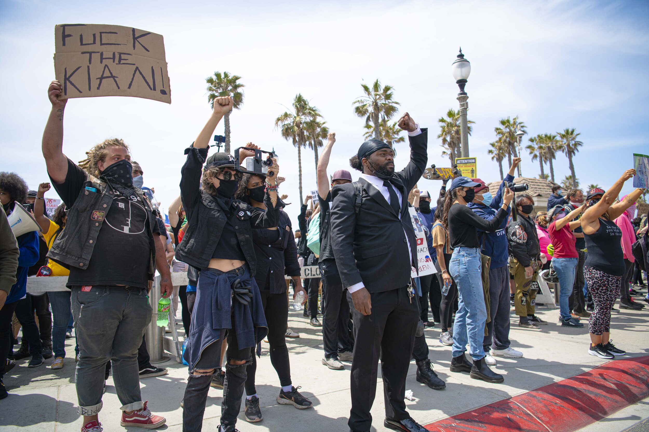  Black Lives Matter President Tory Johnson raises his fist with followers behind him on March 11, 2021, in Huntington Beach Calif. after White Lives Matter members quickly congregate on the other side of the street. Tory, Founder of the Huntington Be