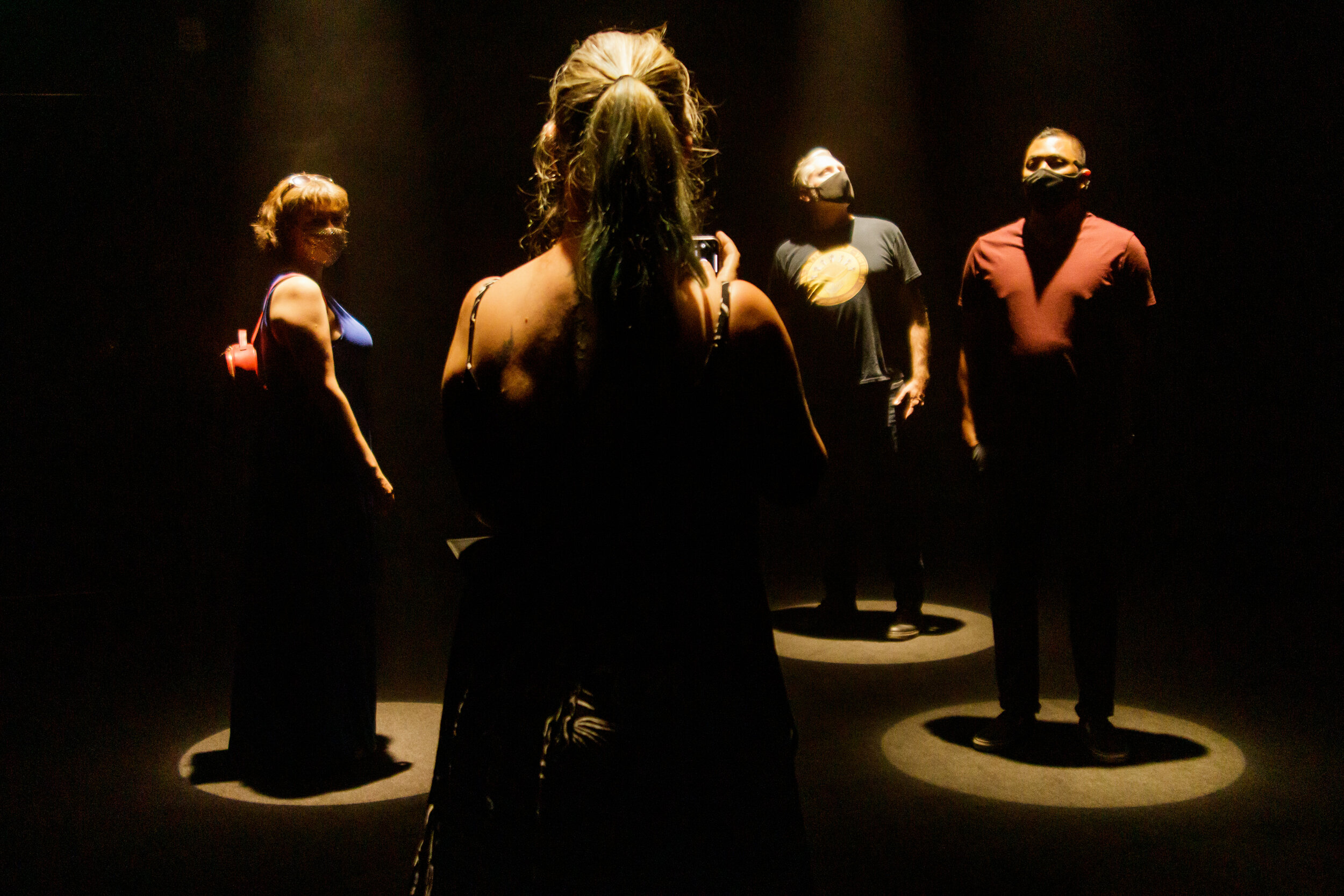   Visitors enjoying a room where lights beam down on a visitor when they step into certain areas of the room, in downtown Los Angeles, Calif., on Saturday, May 8, 2021. Marco Pallotti | The Corsair  