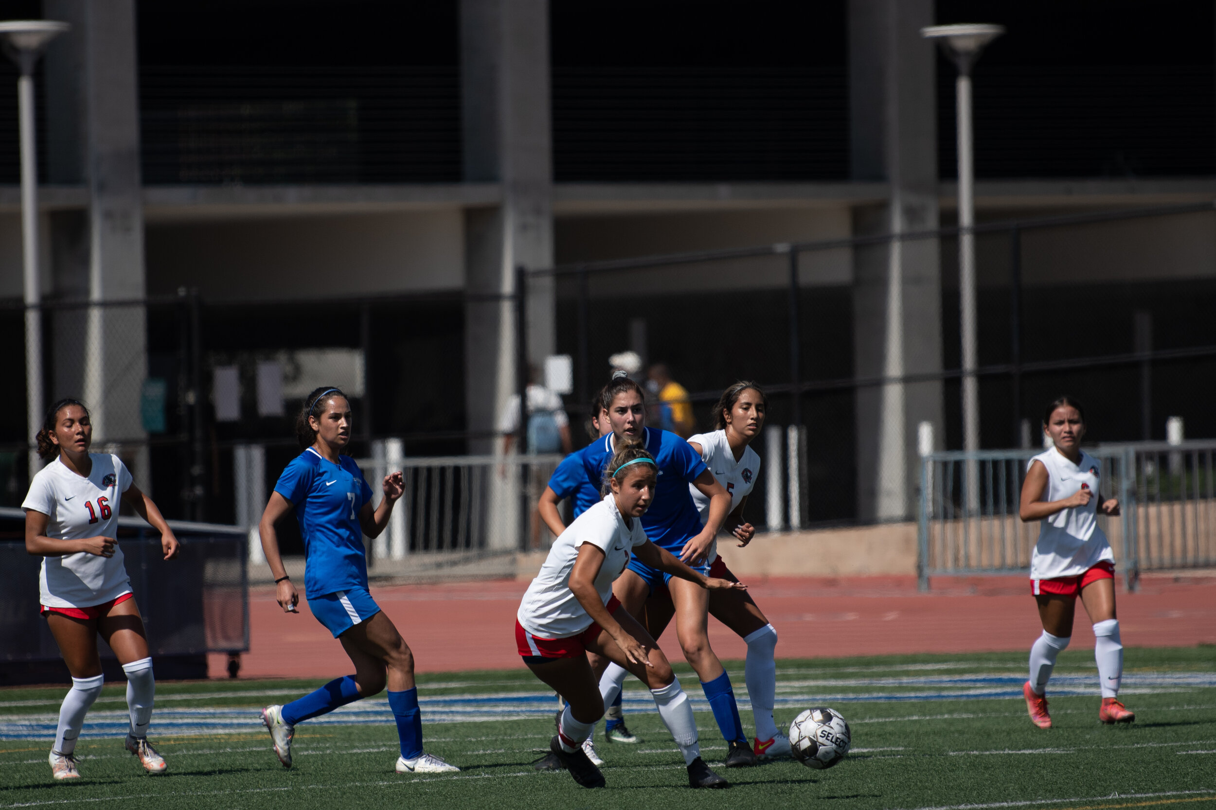  Paola Pena and Alexia Mallahi (L-R) of the Santa Monica College woman's soccer team work to get the ball away from the goal with a Charlie College team member contesting them on the Santa Monica College Corsair Field in Santa Monica, Calif. on Septe