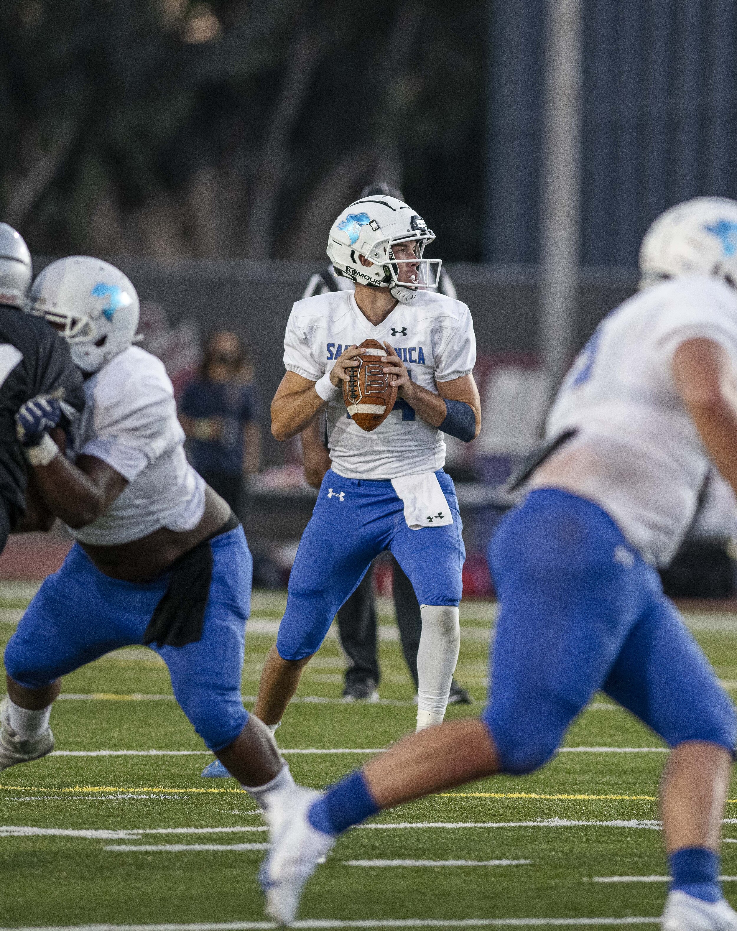  Quarterback Sam Vaulton (14), of the Santa Monica College, drops back and looks for open receivers on a long third-down on September 11, 2021 at Compton College in Compton, Calif. (Jon Putman | The Corsair) 