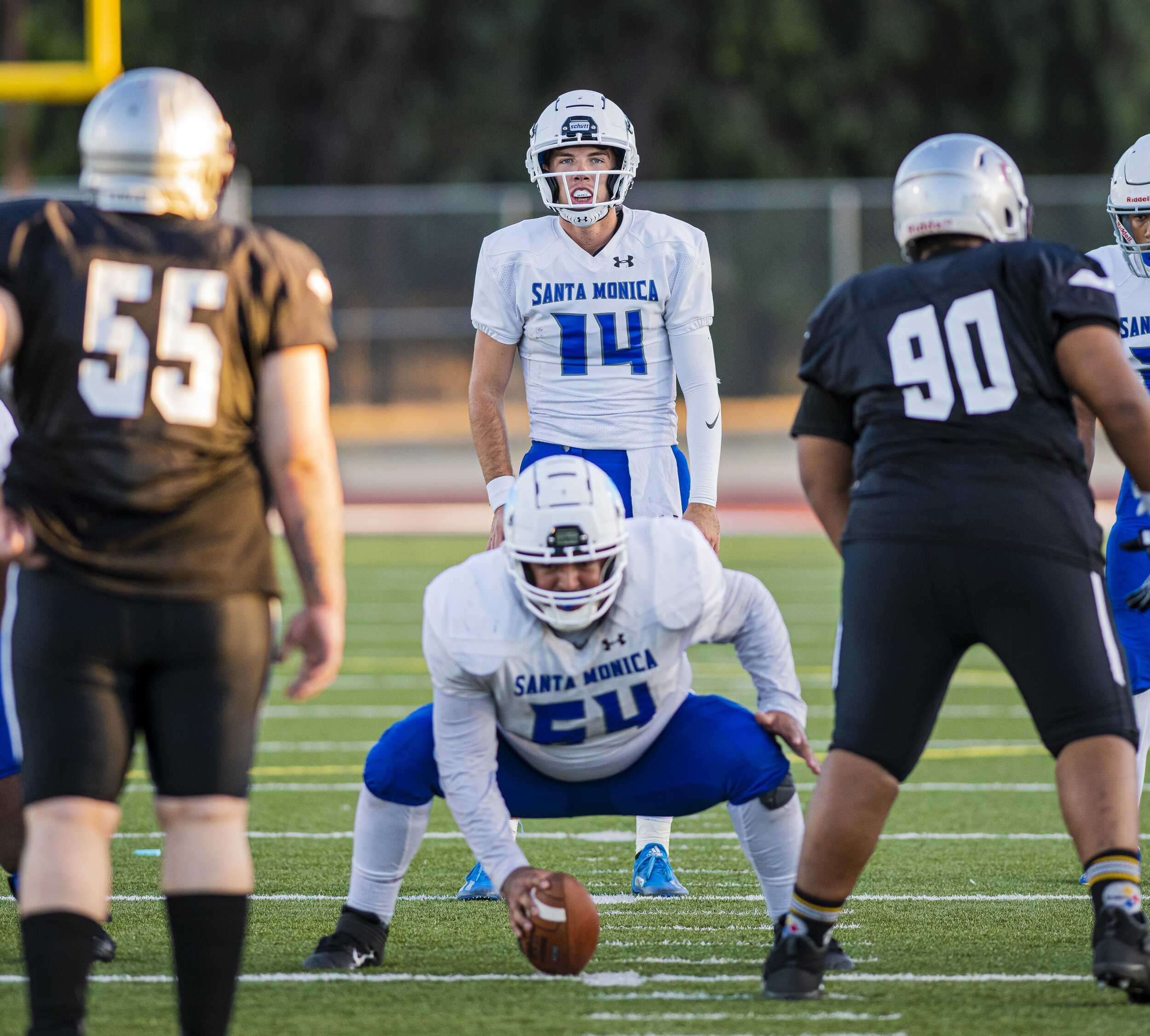  Sam Vaulton (14), Quarterback of the Santa Monica College Football Team, prepares to take the snap against the rival Compton College Football team on September 11, 2021 at Compton College located in Compton, Calif. (Jon Putman | The Corsair) 