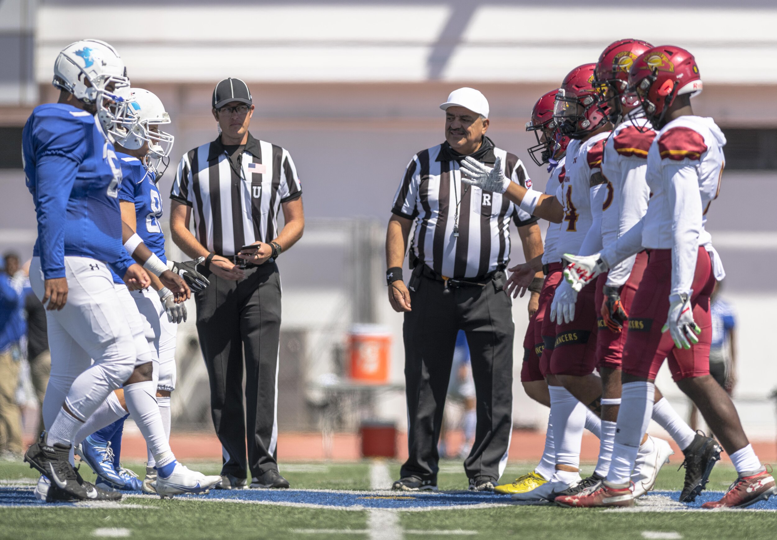  Santa Monica College Corsairs shake the hands with the opposing Pasedena City College Lancers just after the Corsairs win the coin toss. (Jon Putman | The Corsair) 