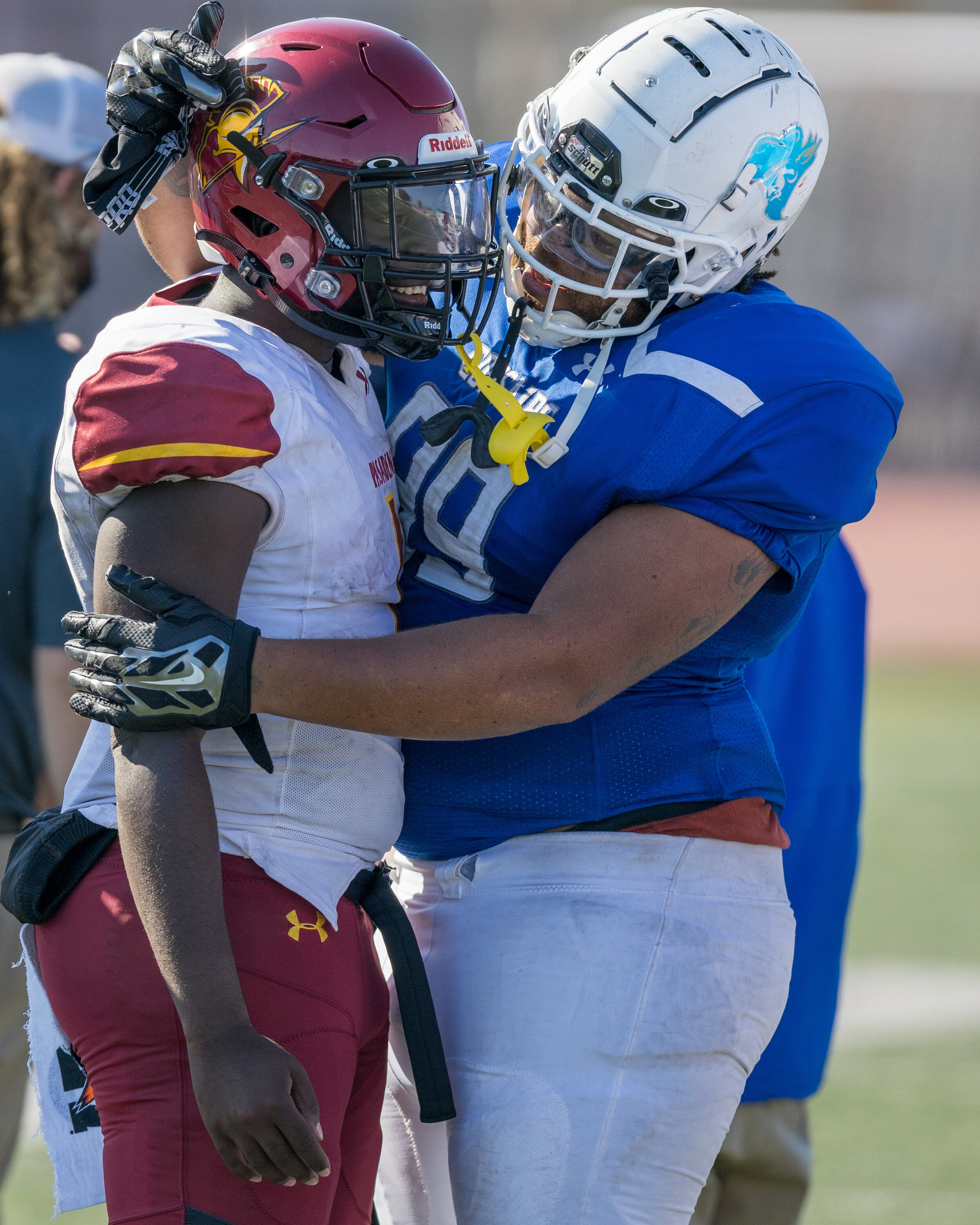  SMC freshman NT Luis Canales embraced an opponent following a loss. The Corsairs fell to 1-2 after loosing to Pasadena City College 43-22.(Maxim Elramsisy | The Corsair) 
