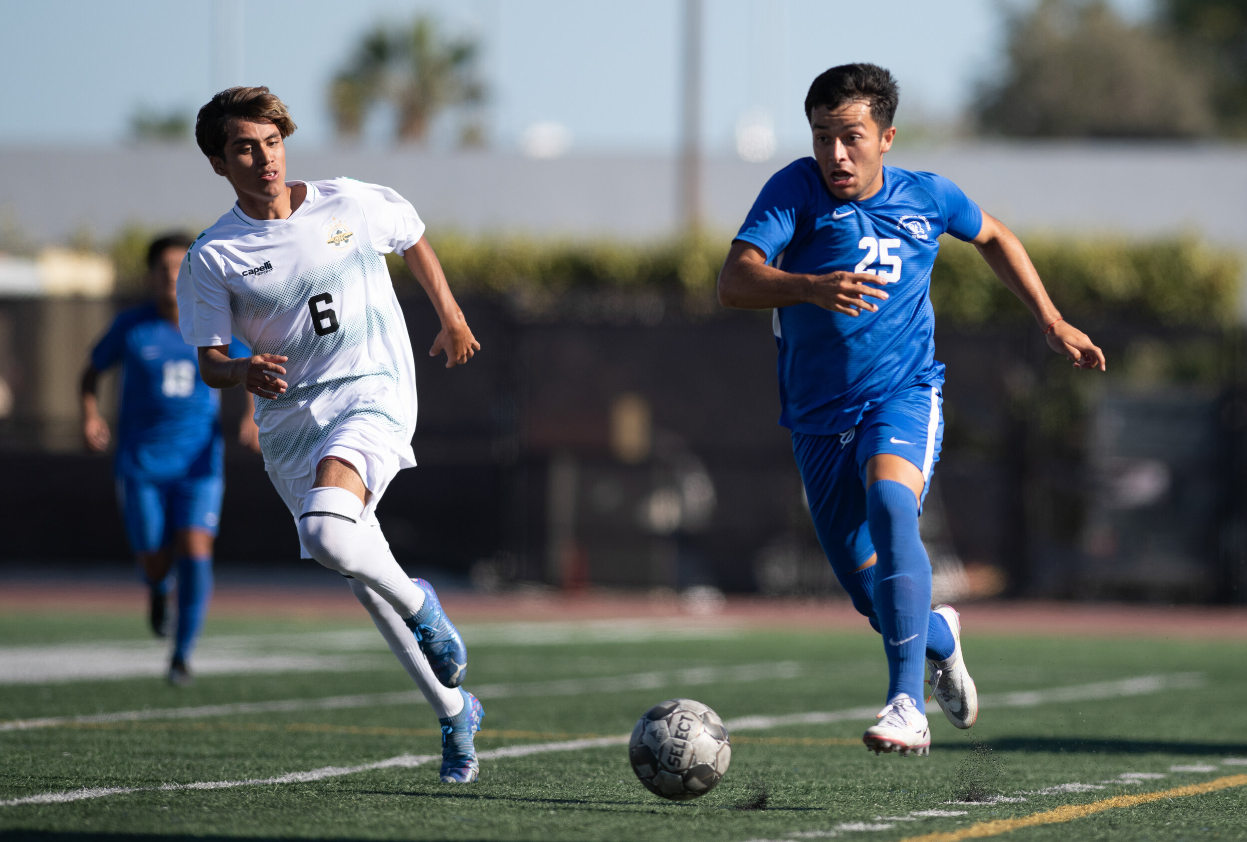  SMC freshman Luis Heredia (25) dribbles the ball down the field as a defender frantically chases him down on September 21, 2021 at Santa Monica College in Santa Monica, Calif. (Jon Putman | The Corsair) 