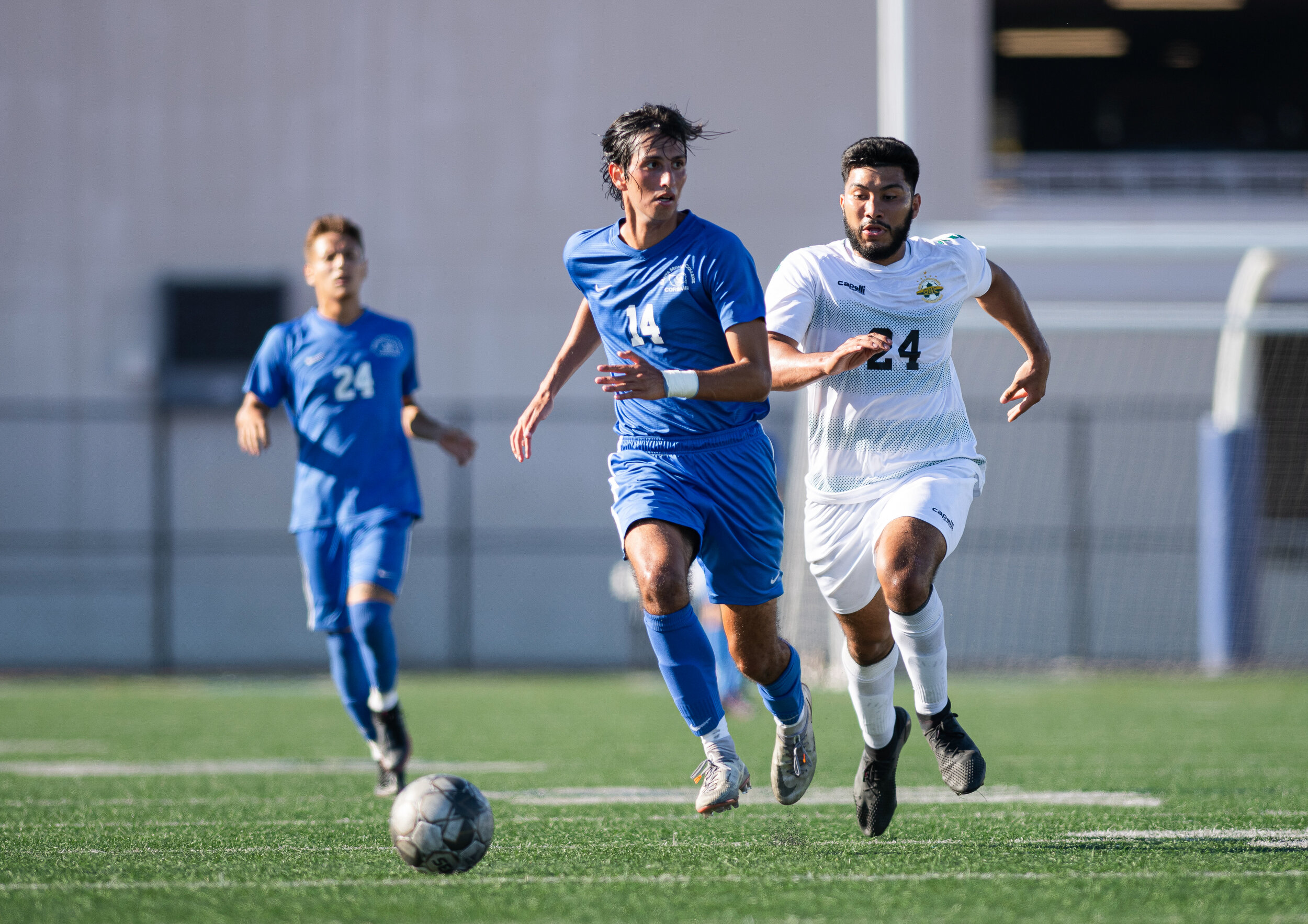  SMC sophomore Sean Mcdonnell (14) dribbles the ball down field as a defender trails behind him on September 21, 2021 at Santa Monica College in Santa Monica, Calif. (Jon Putman | The Corsair) 