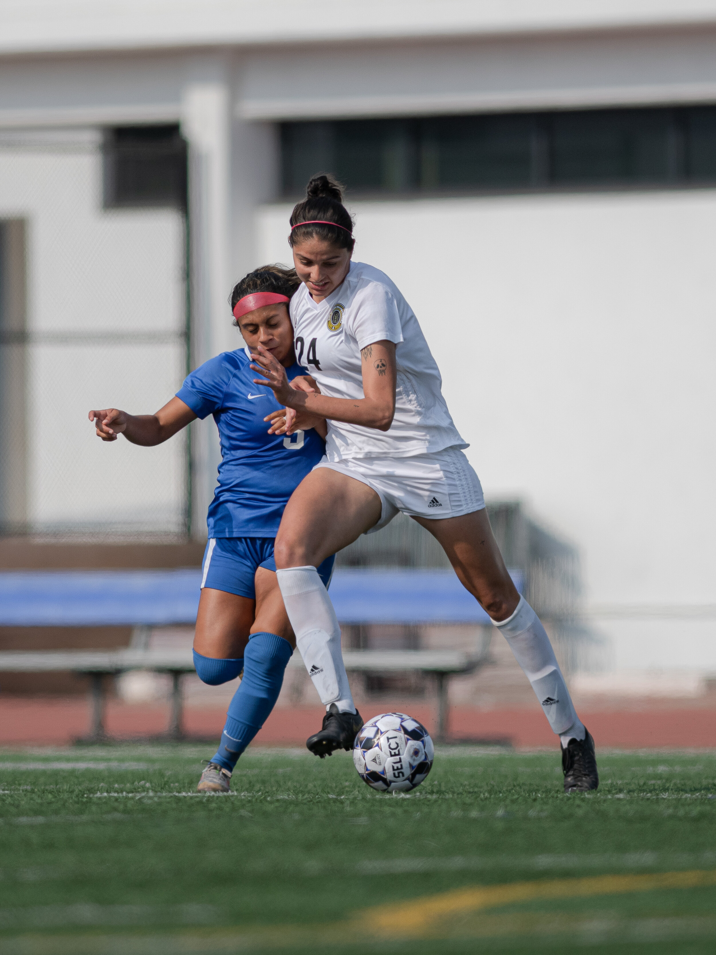  SMC sophomore Monica Moya (3) gets hit by a defender as she tries to take the ball down field. (Jon Putman | The Corsair) 