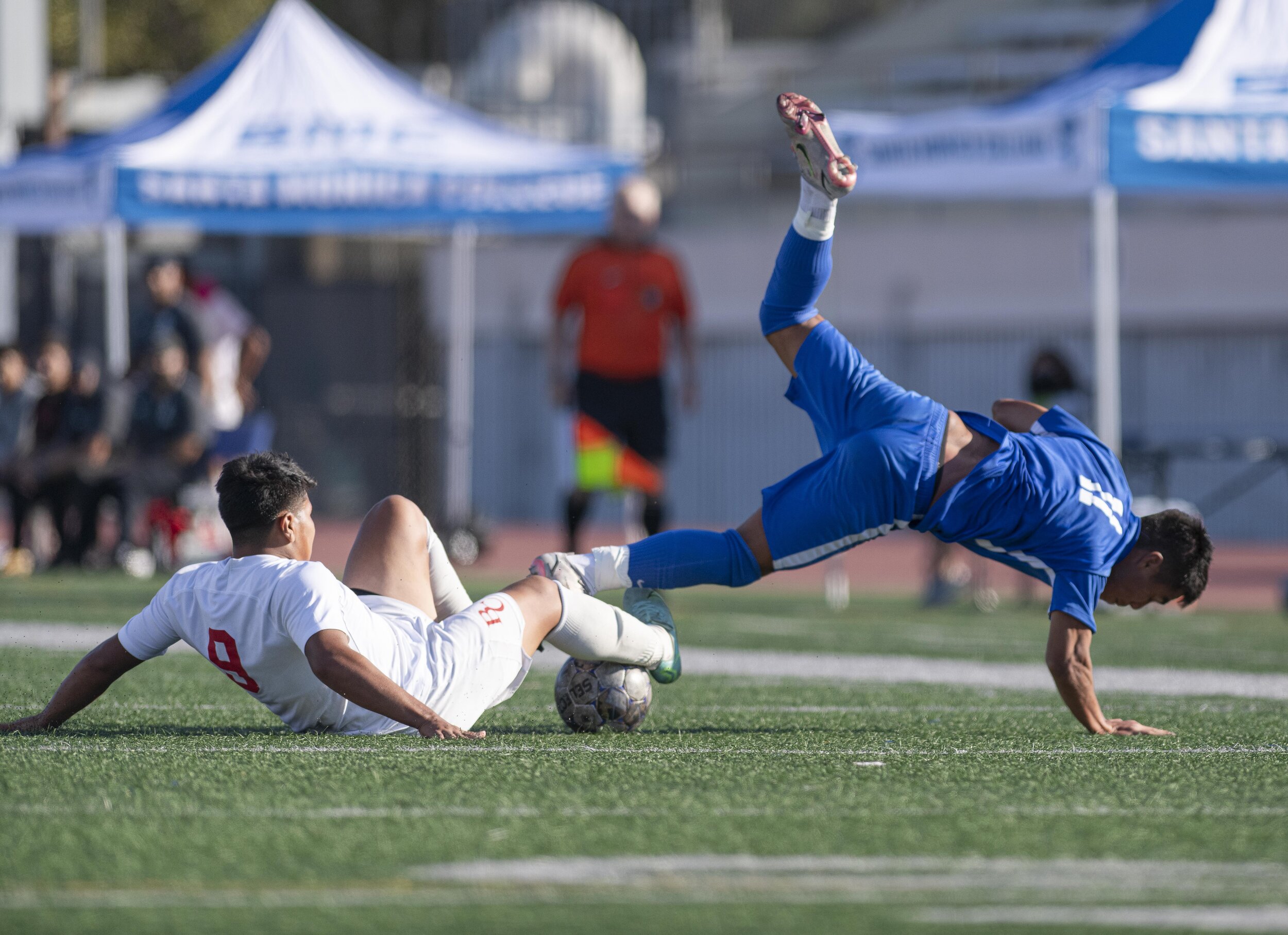 Santa Monica College Corsairs freshman Denilson Garcia (11) gets viciously tripped dribbling the ball down field after the Corsairs took the 4-2 lead with only a few minutes left in the game. (Jon Putman | The Corsair) 