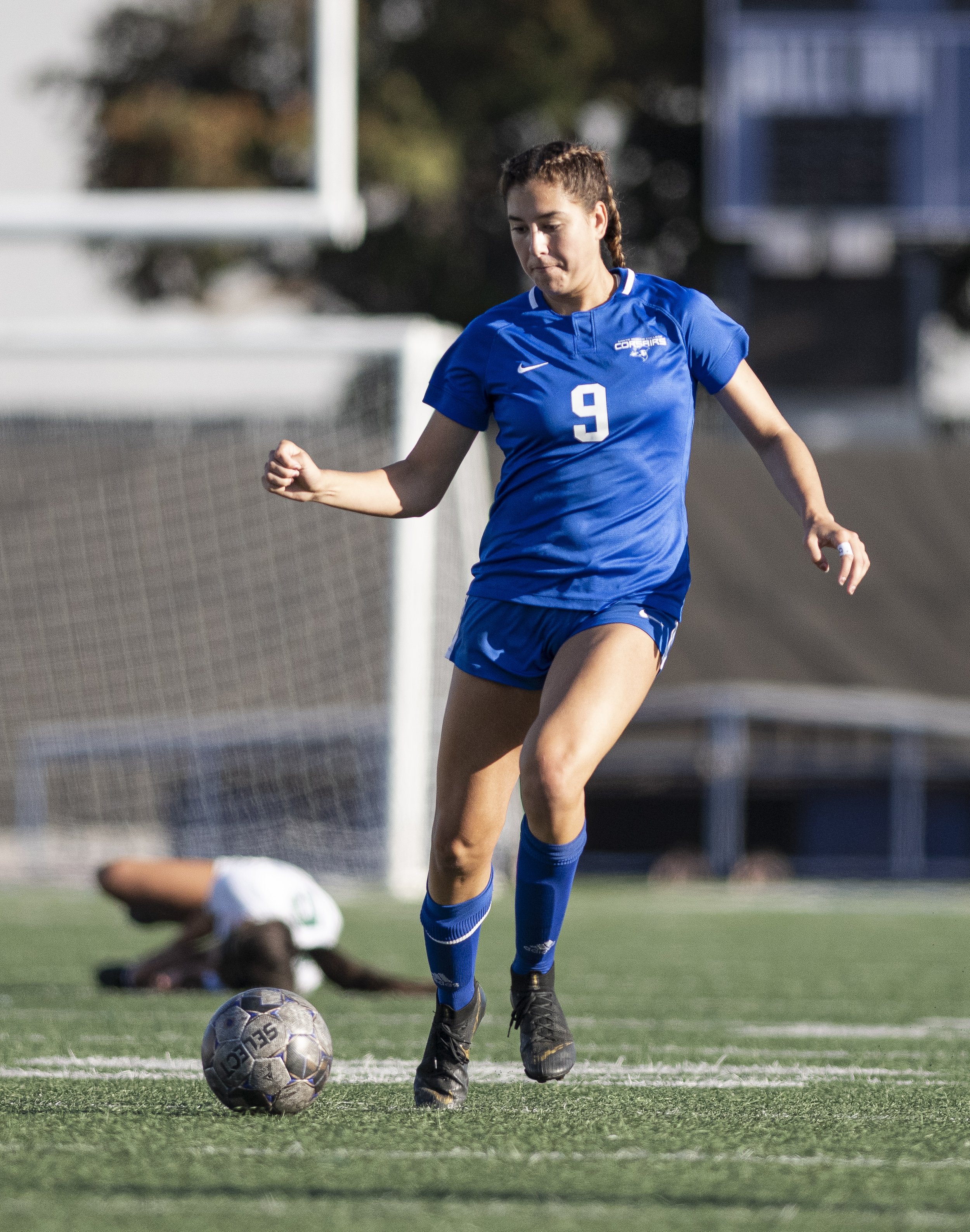  Santa Monica College Corsairs freshman Alexia Mallahi (9) dribbles the ball down field after taking a Valley player down minutes before the time expired on the game. (Jon Putman | The Corsair) 