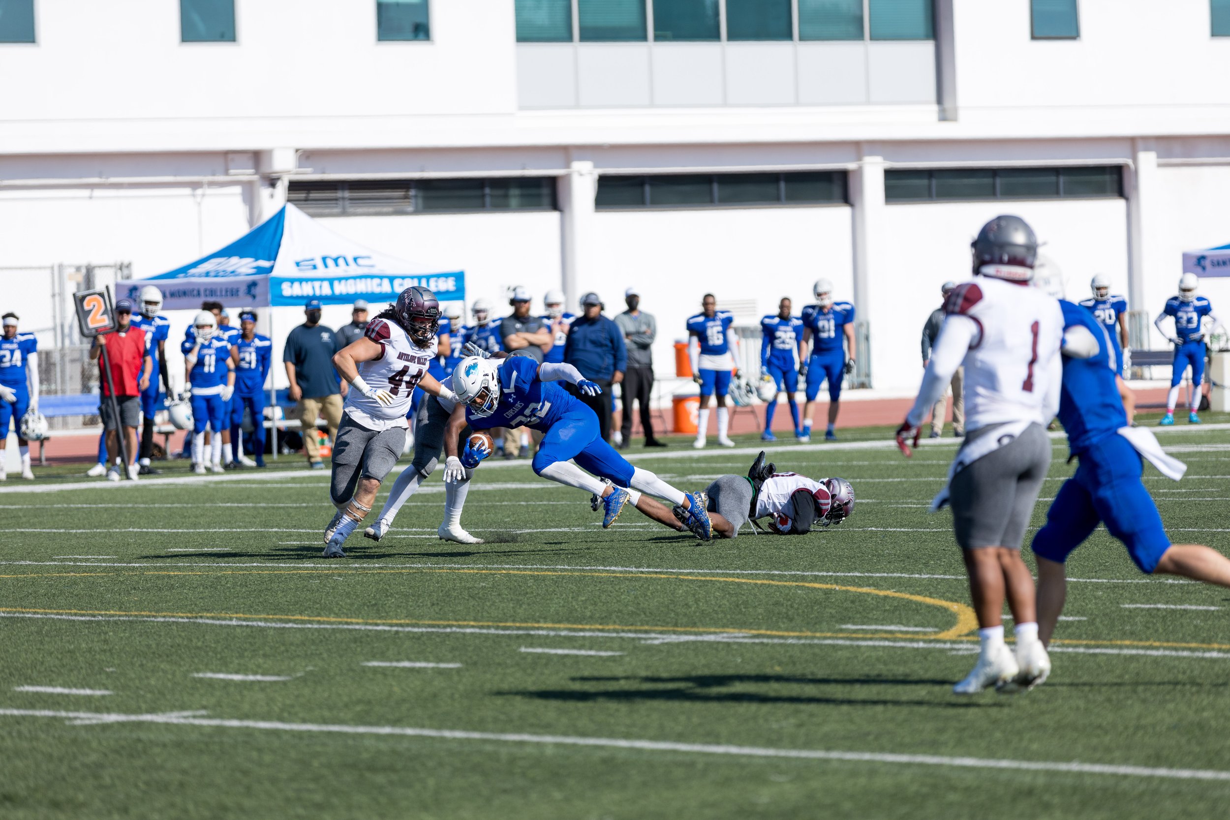  SMC RB (32) slips a tackle.  Santa Monica College lost to Antelope Valley 36-31 in Santa Monica, California on October 23, 2021.(Maxim Elramsisy | The Corsair) 