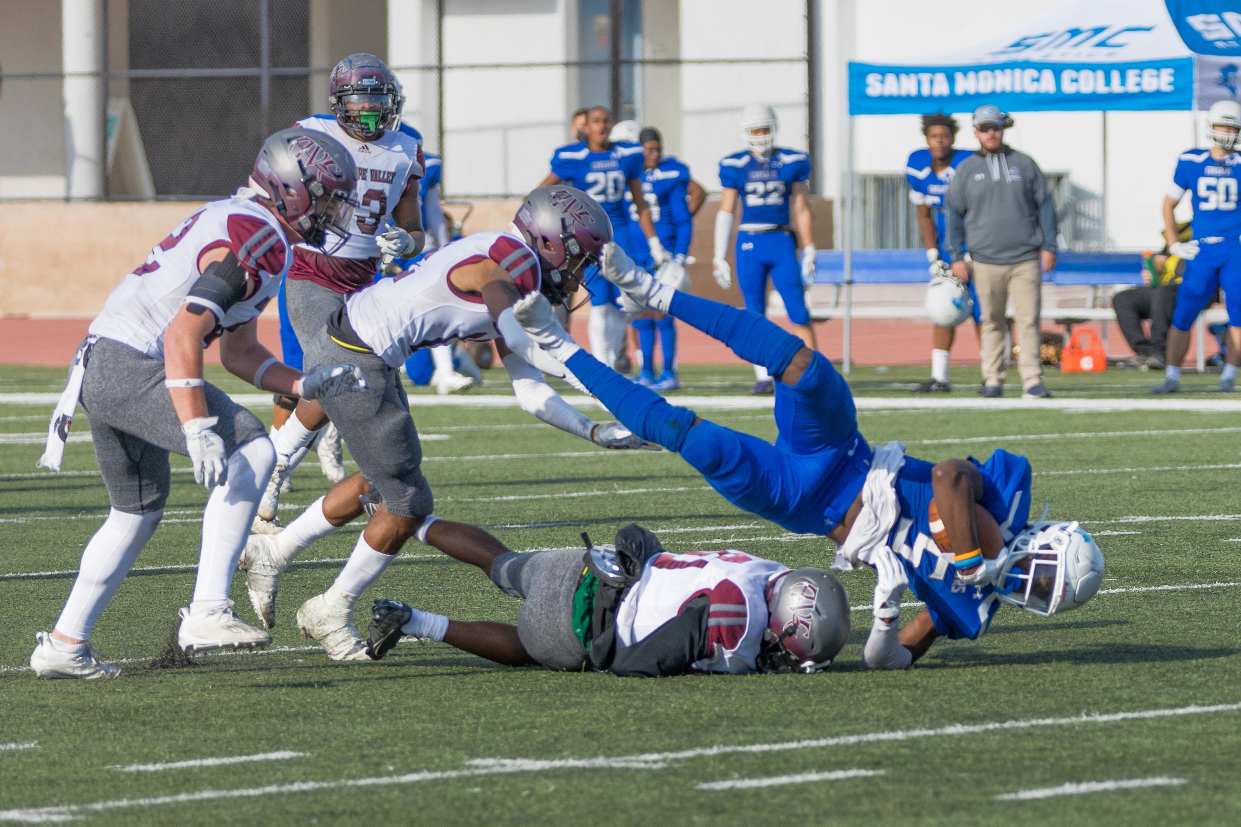  SMC sophmore WR Tariq Brown (5) is tackled after making a catch in the center of the field.  Brown lead the team in catches with 10 for 210 yards and 2 touchdowns. Santa Monica College lost to Antelope Valley 36-31 in Santa Monica, California on Oct