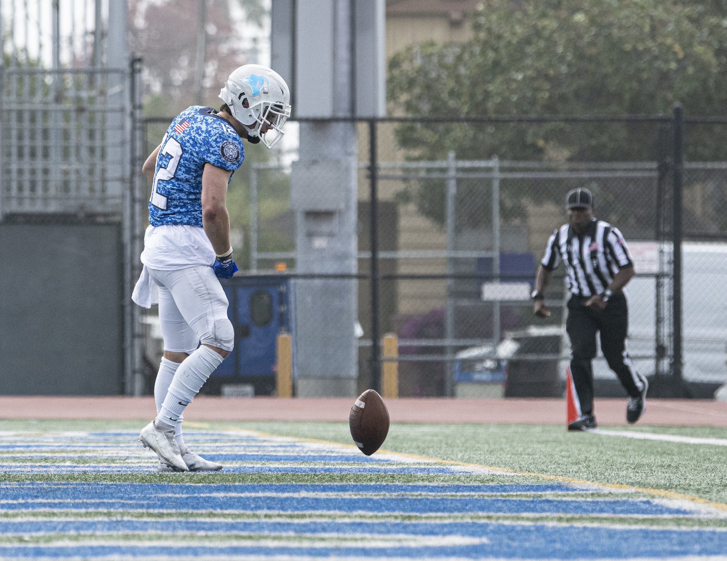  Santa Monica College Corsairs freshman WR Gunnison Bloodgood (12) spins the ball in the endzone after making a difficult touchdown at LA Valley. He was penalized 15 yards for unsportsmanlike conduct. (Jon Putman | The Corsair) 
