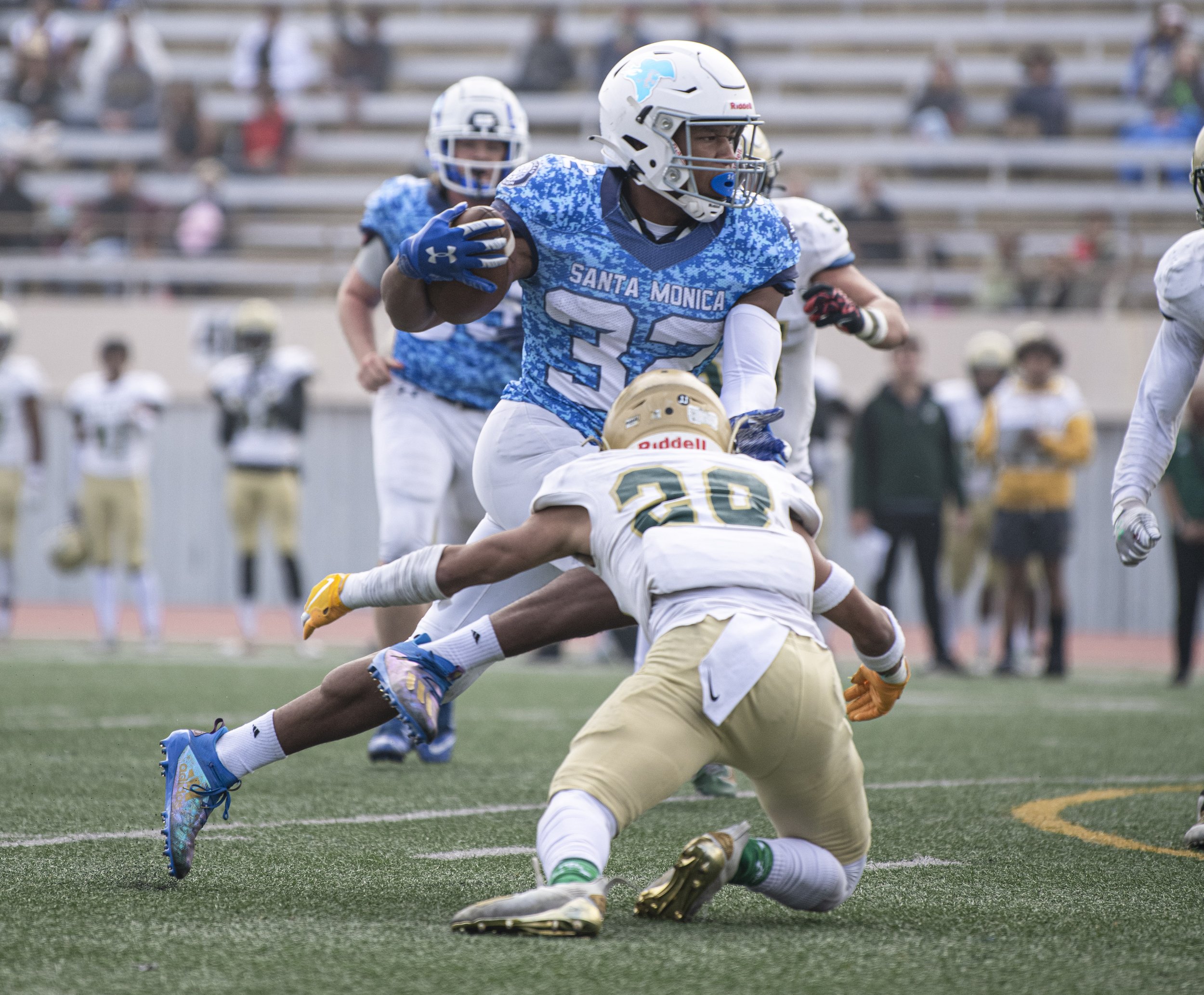  Santa Monica College Corsair player runs the ball through a LA Valley player as he attempts to reach the endzone. (Jon Putman | The Corsair) 