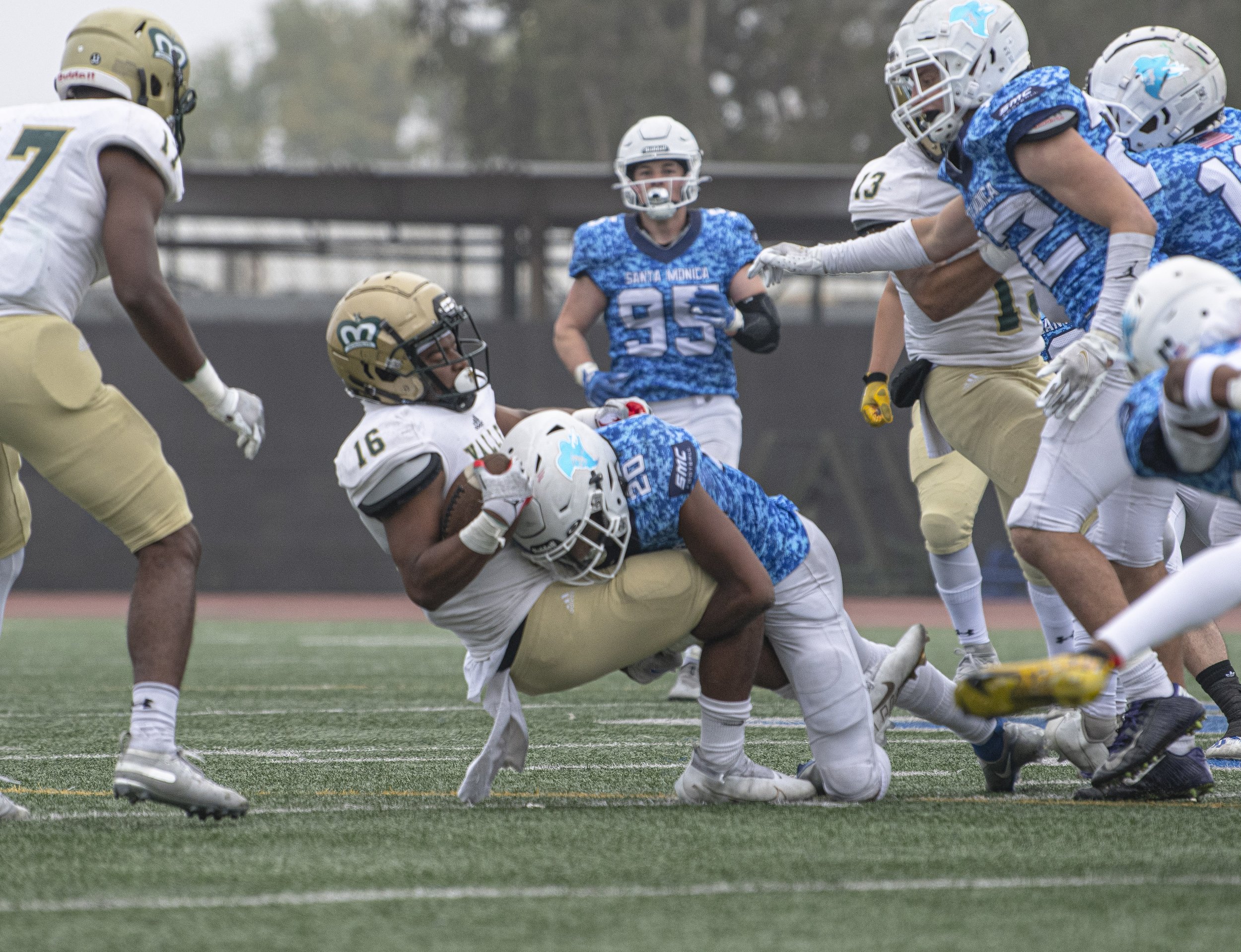  Santa Monica College Corsairs freshman WR Jai Guess (20) tackles the LA Valley player who had just intercepted the ball from the Corsairs. (Jon Putman | The Corsair) 