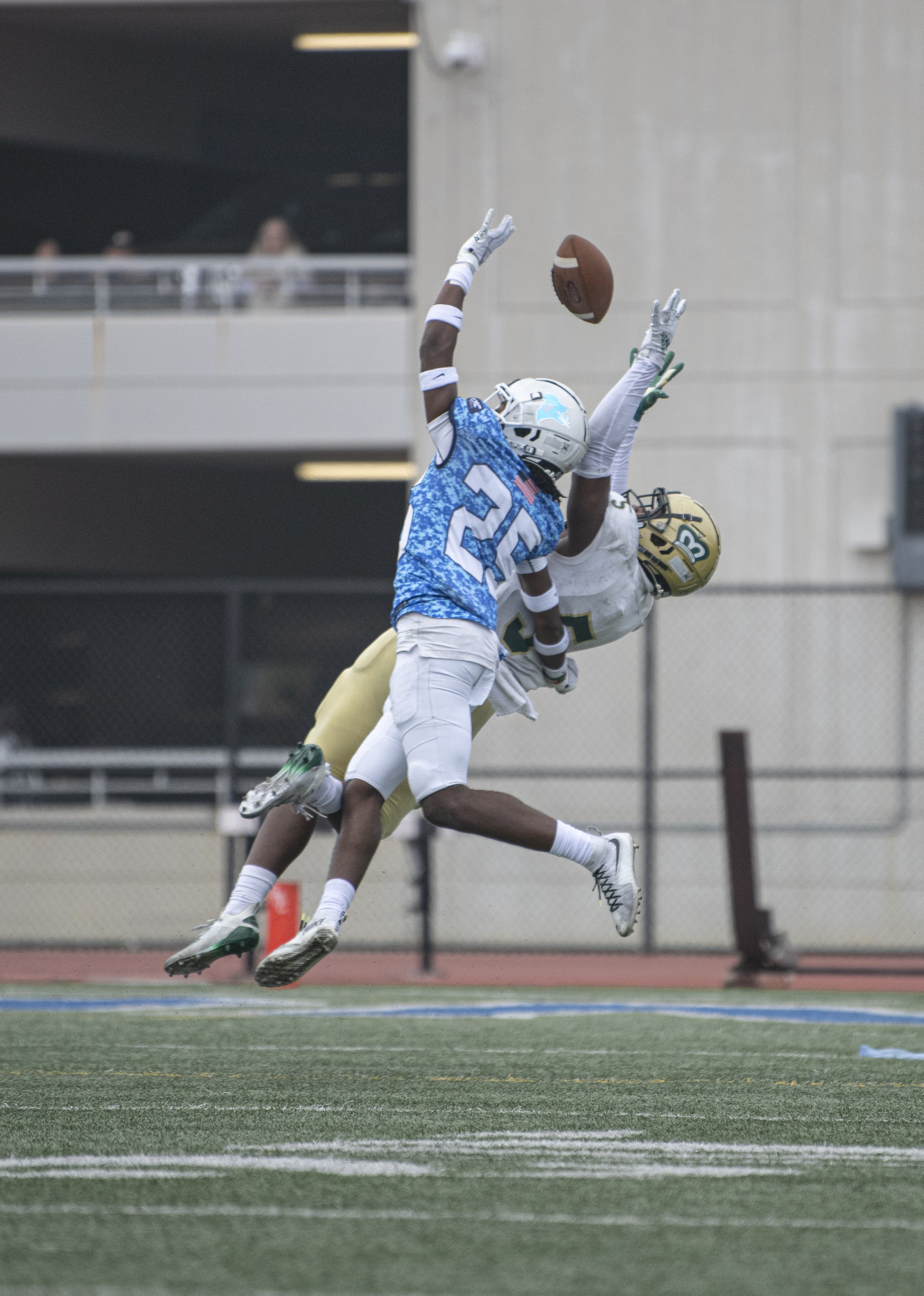  Santa Monica College Corsairs freshman DB Nevan Lambert (25) just misses the ball as he and a LA Valley player go up for a jump ball in the endzone. (Jon Putman | The Corsair) 