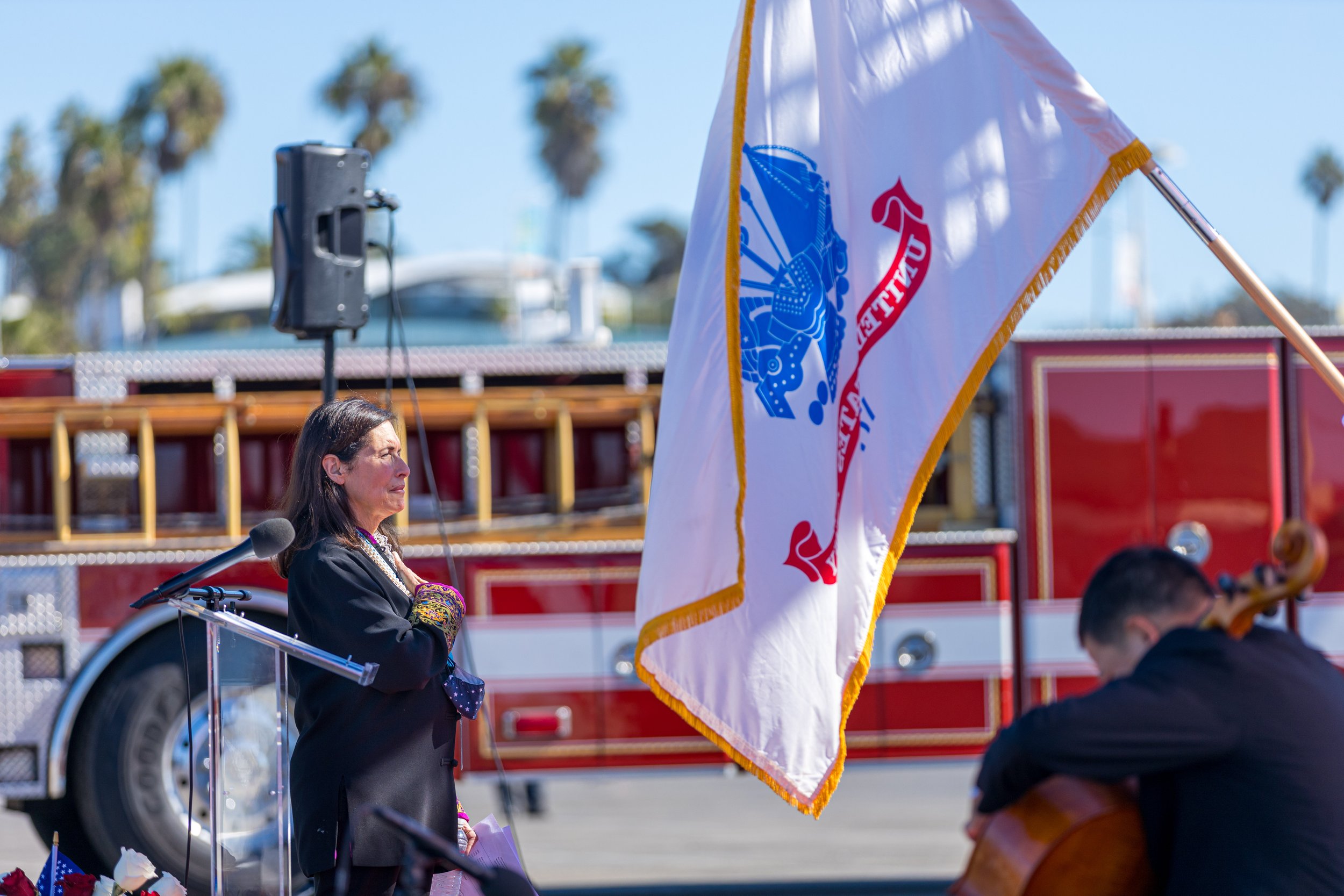  Mayor Sue Himmelrich salutes the US Army flag at the Veterans Day commemoration near the Santa Monica Pier in Santa Monica, California on November 11, 2021. (Maxim Elramsisy | The Corsair) 