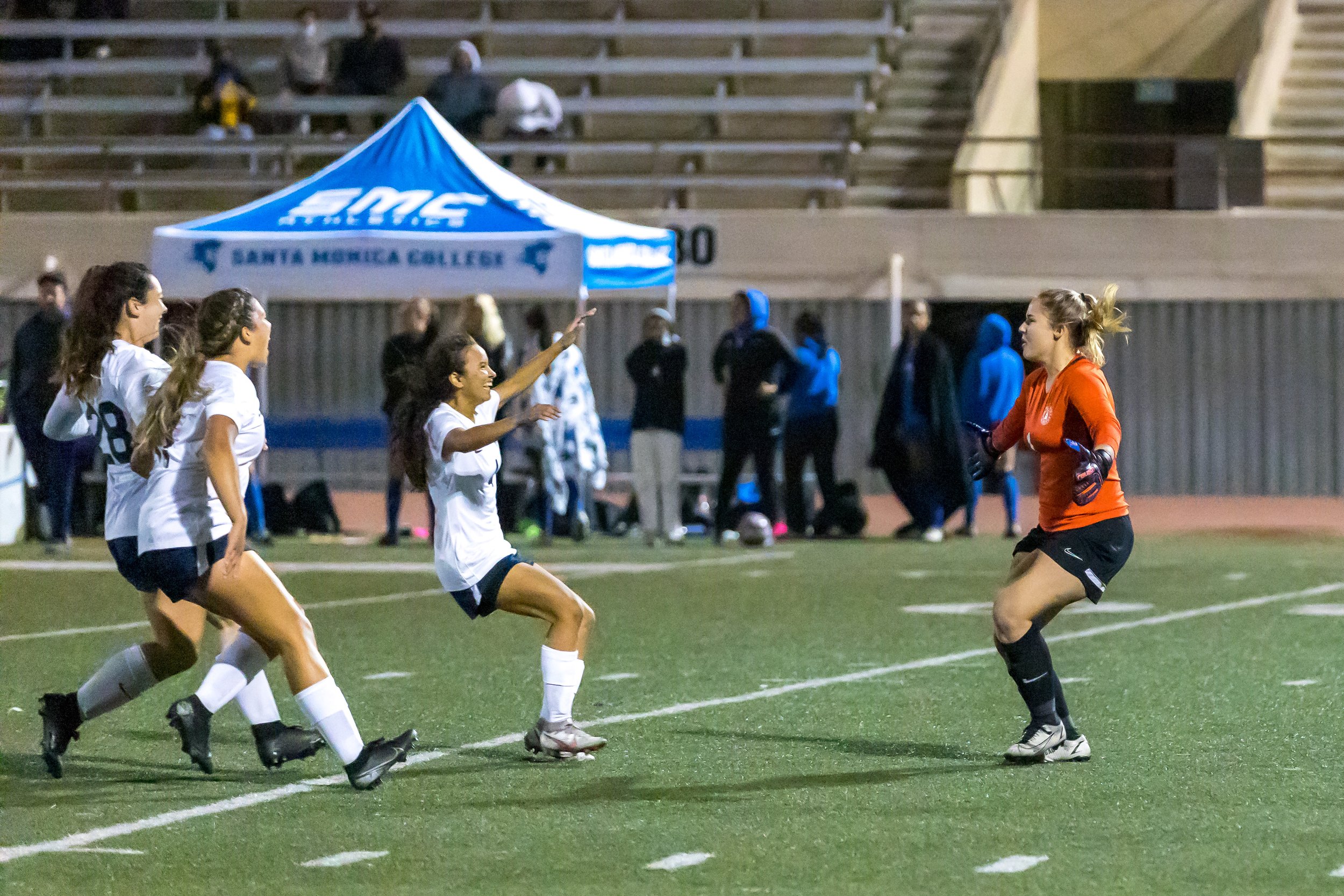  Freshman goalkeeper McKenna Morey celebrates with her teammates after she shots the game winning penalty for the El Camino College Warriors. Santa Monica College played against El Camino College in a California Community College Women's Soccer South