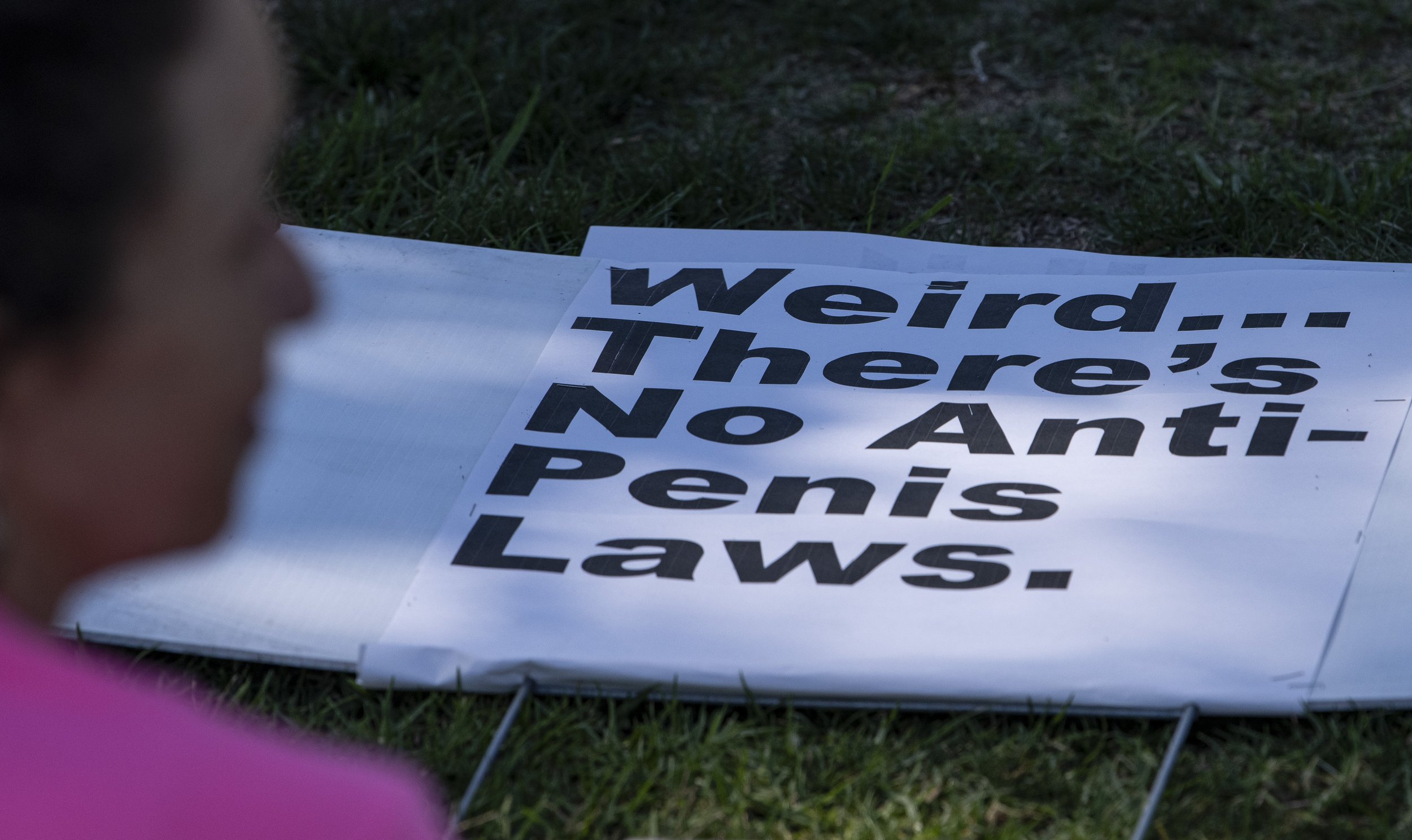  A supporter of the Womens abortion march held at the Beverly Gardens Park located in Beverly Hills, Calif. Sat. Oct. 2, sits next to her sign before the rally begins. (Jon Putman | The Corsair) 