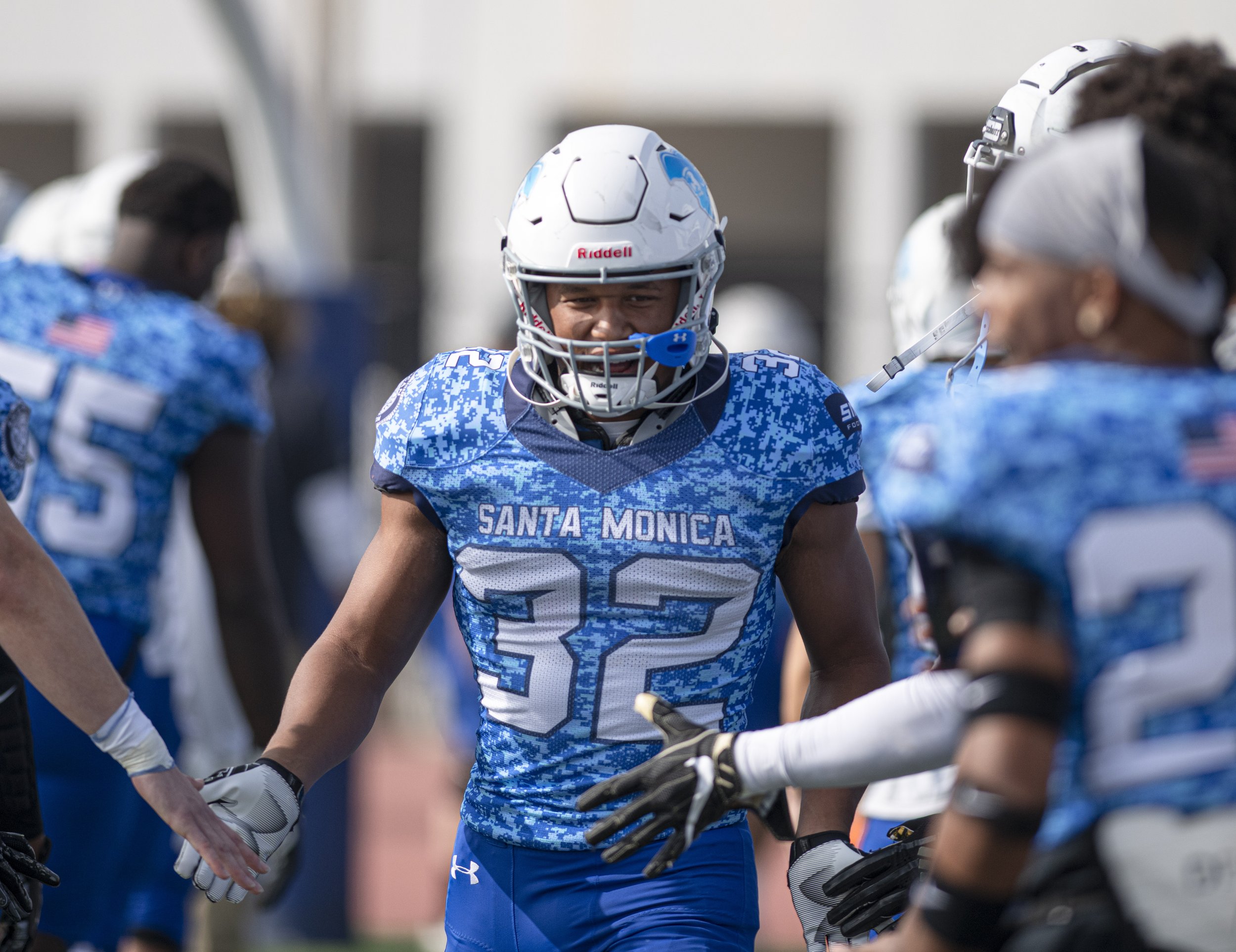  Corsairs sophomore runningback Hassan Biggus (32) runs through the row of SMC players as sophomores are announced for their final game against West L.A. College on Nov. 20, 2021 at Santa Monica College. Biggus received All Conference First Team Hono
