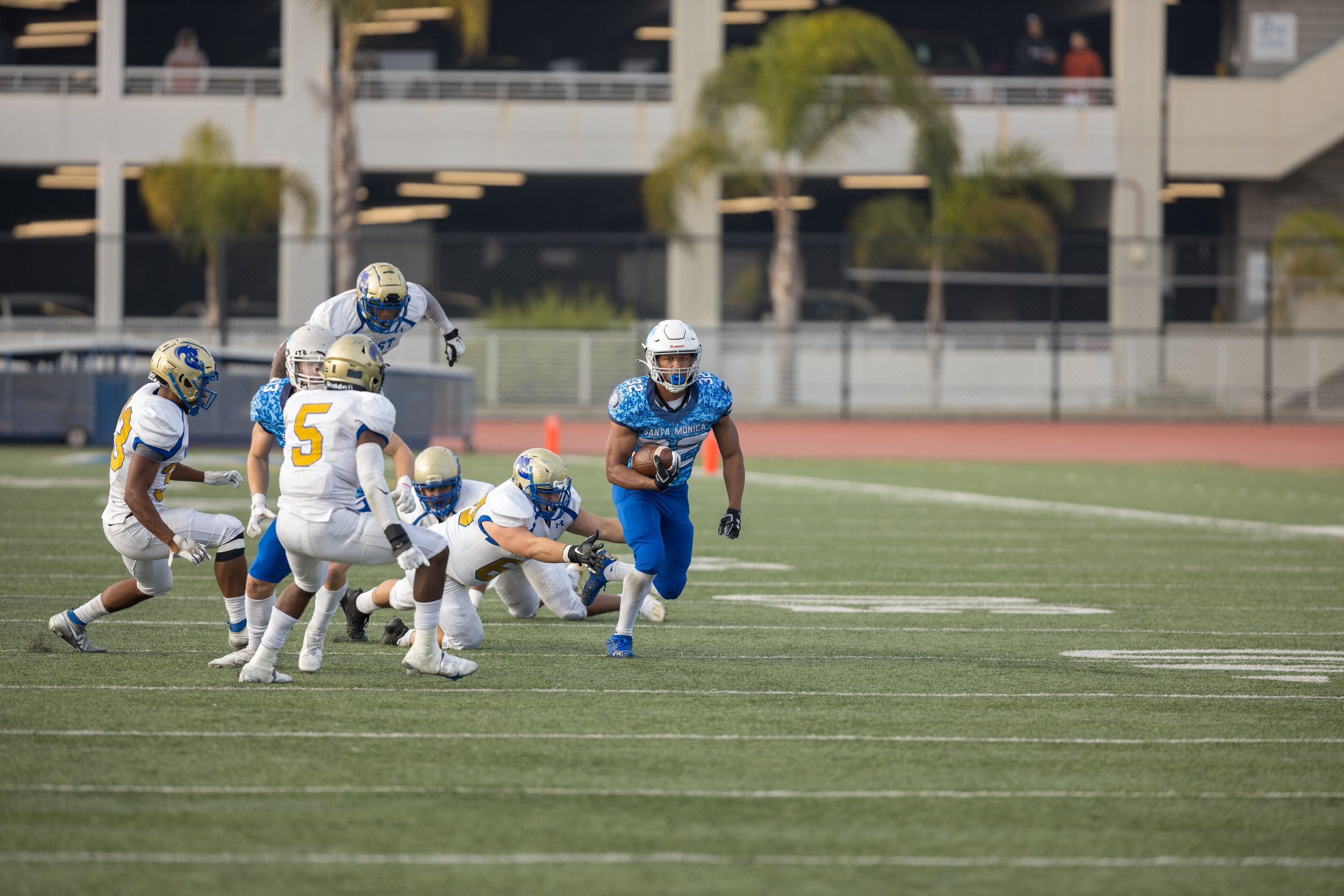  Corsairs sophmore runningback Hassan Biggus (32) evades defenders against West L.A. College on Nov. 20, 2021 at Santa Monica College. Biggus received All Conference First Team Honors. (Maxim Elramsisy | The Corsair) 