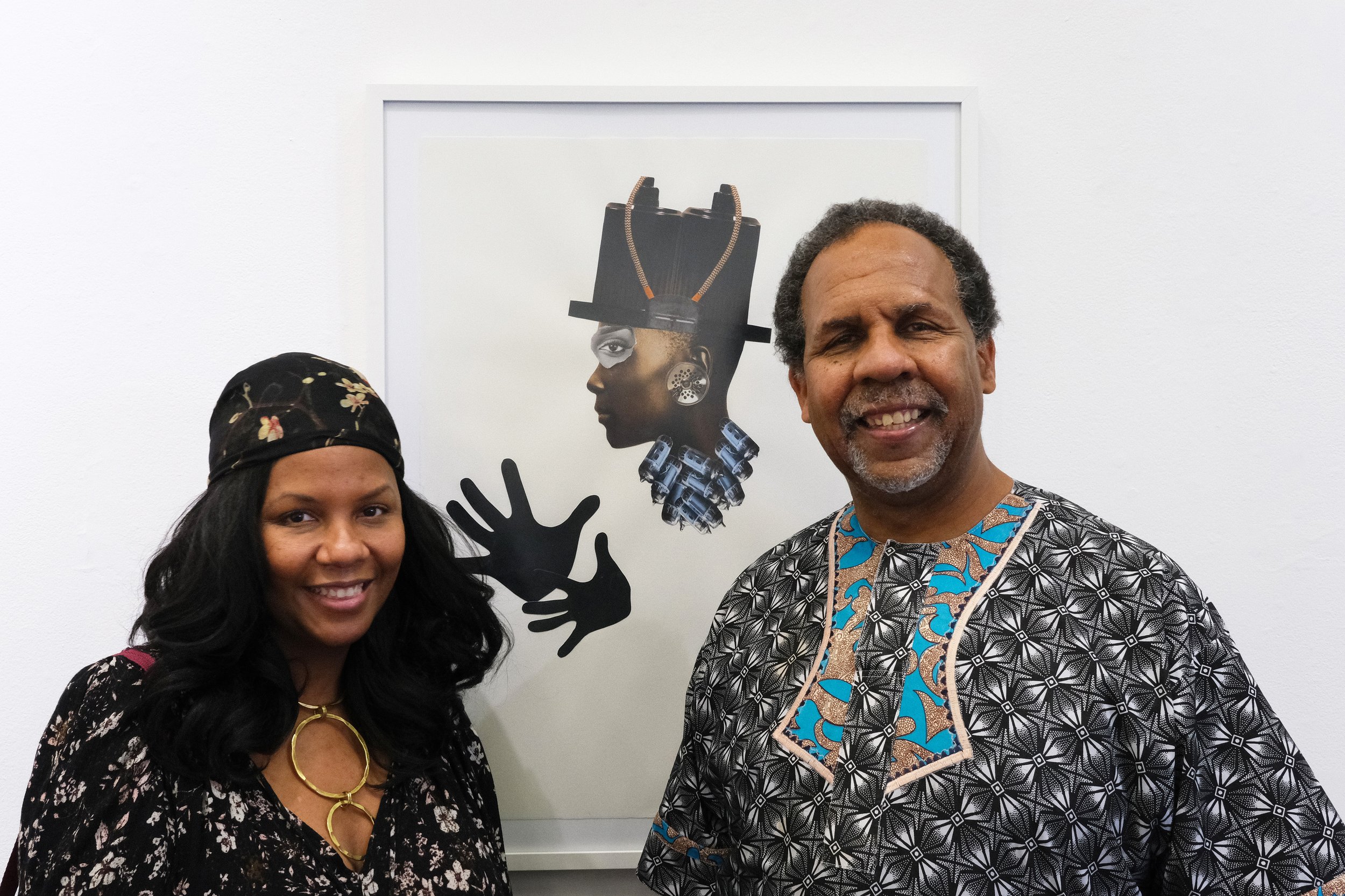  Melanie Buster (left) invited her father Charles Buster (right) to attend the Black History-Themed Art Walk at the Building Bridgers Art Exchange Gallery, in Santa Monica from an advertisement she came across on social media. They stand in front of 