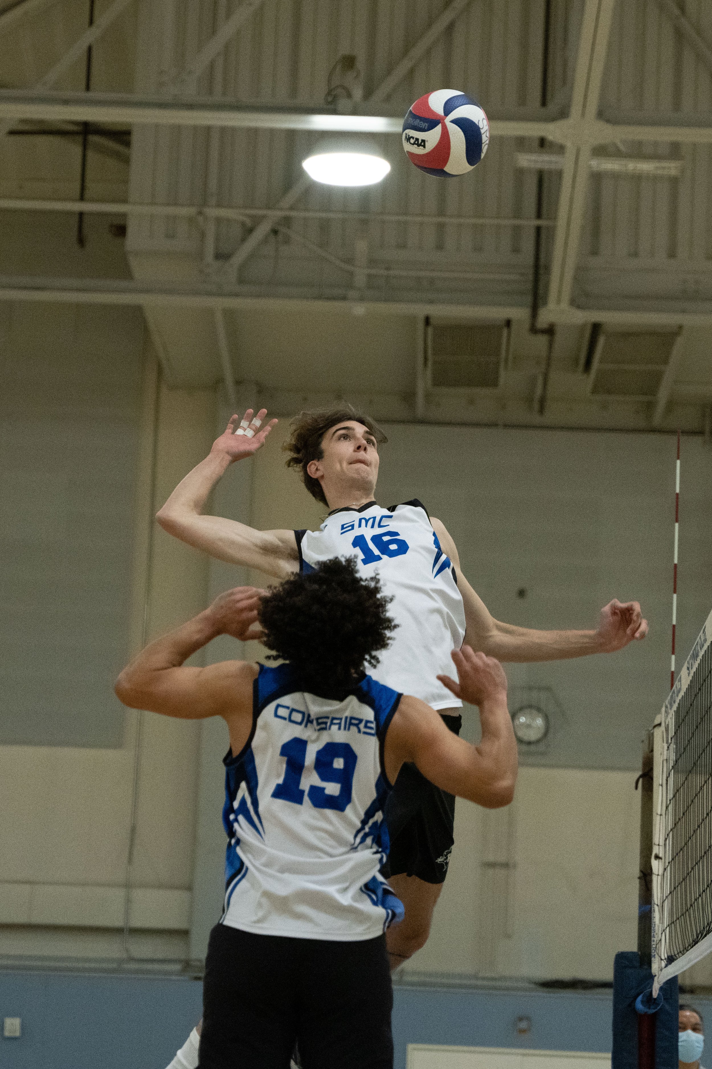  Santa Monica College Corsairs Freshman Grant Hall (16) prepares to spike the ball as his team- mate, Sophomore Elijah Chambers (19), watches during the game against the Moorpark College Raiders in The Pavilion in Santa Monica, Calif. on March 4. (Ry
