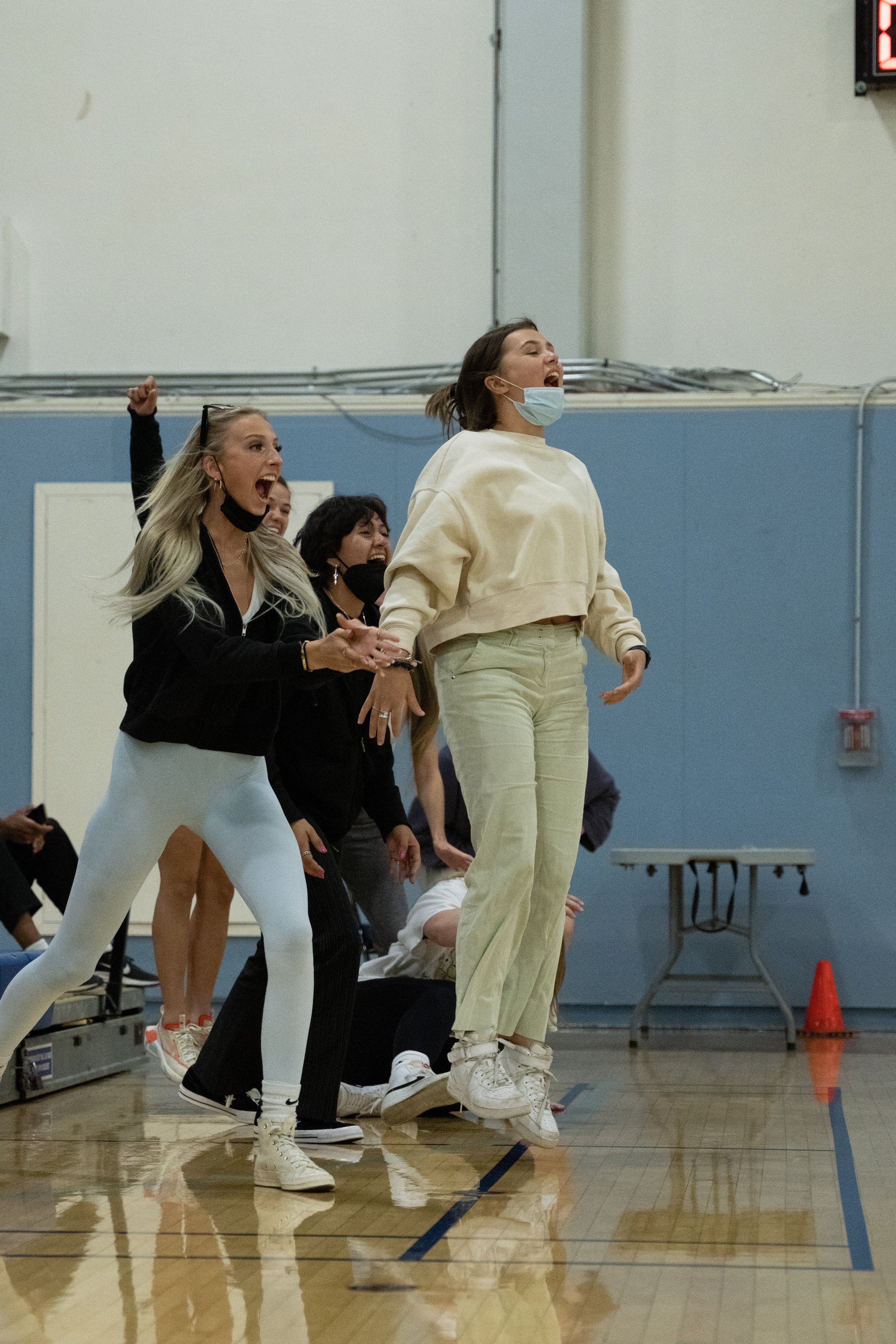  Santa Monica College student athletes Sophia Laurence, January Nava, and Kenzie Wolff cheer- ing on the mens' volleyball team during the game against Moorpark College. (Ryan Martinez | The Corsair) 