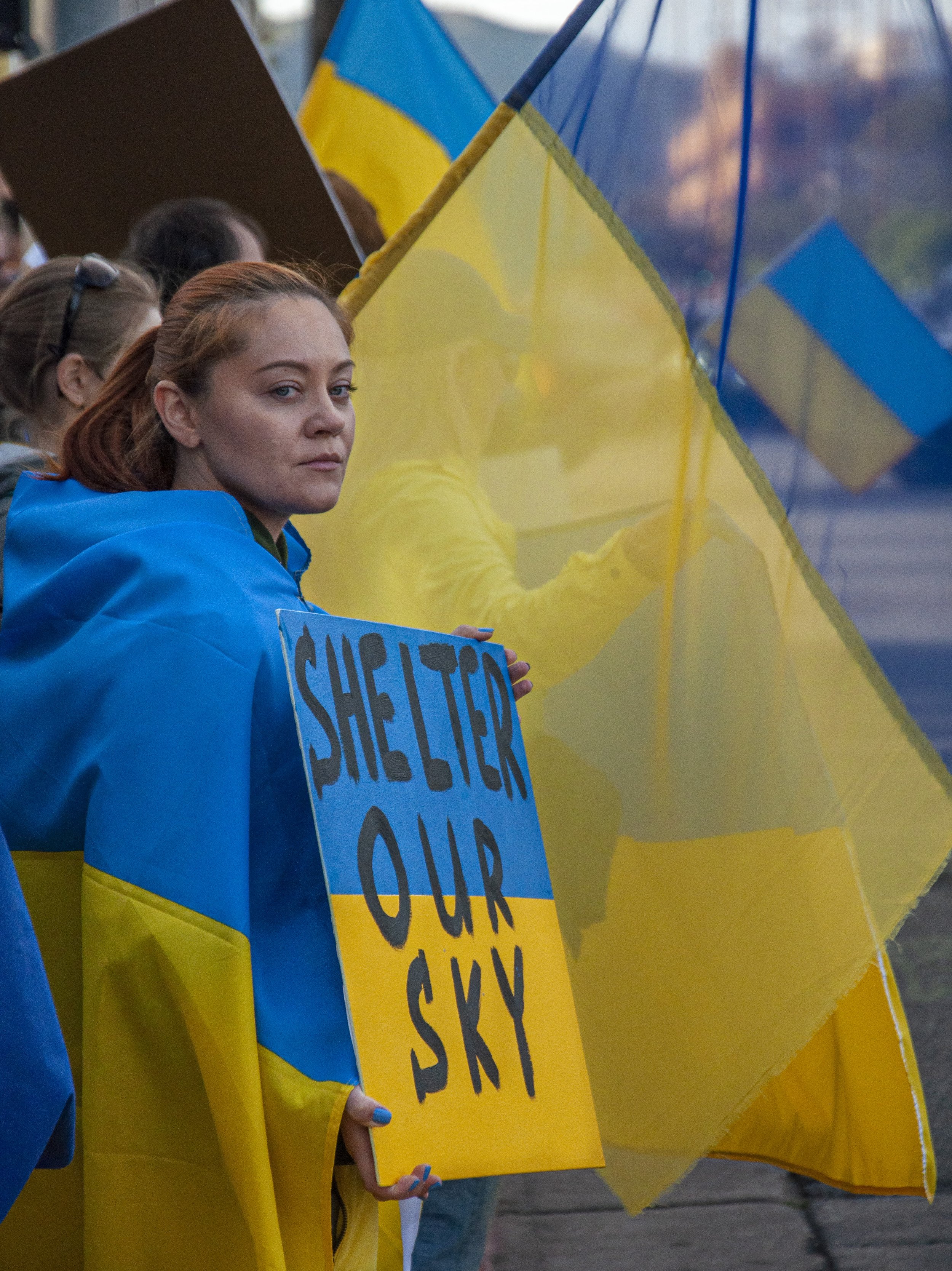  Maryna Omelchenko holding a sign that says "Shelter Our Sky" at the "Support Ukraine" protest on Feb. 26, at 11111 Santa Monica Blvd located in Los Angeles (Forrest Flanders | The Corsair) 