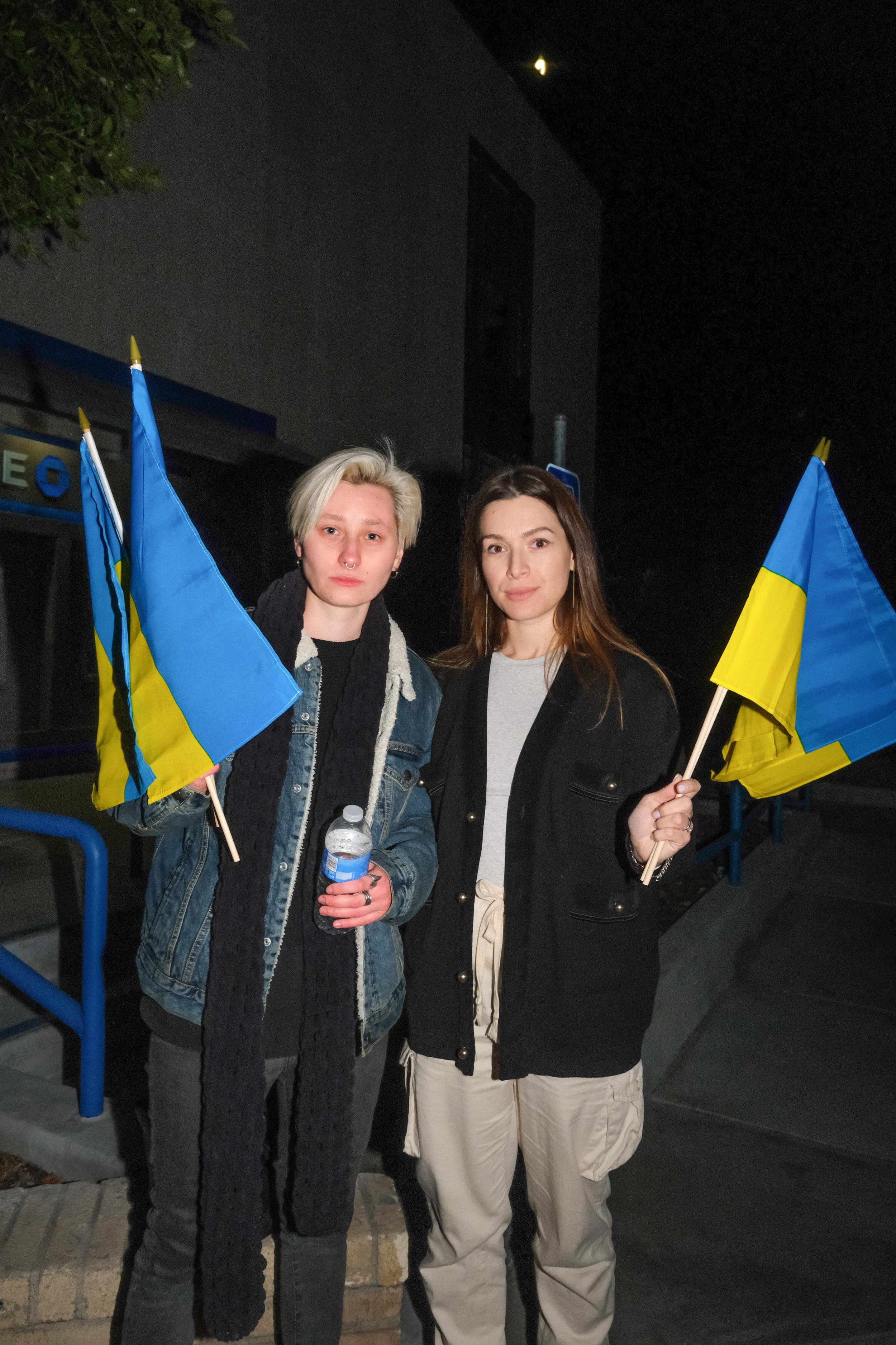  To the left, Anna Shvygar (right), has family in Ukraine that she says “are not sleeping all night. Shaking, hearing the missiles and airplanes flying over their houses, and not knowing what to say to their kids.” Liza Svietna (left) said, “I have b