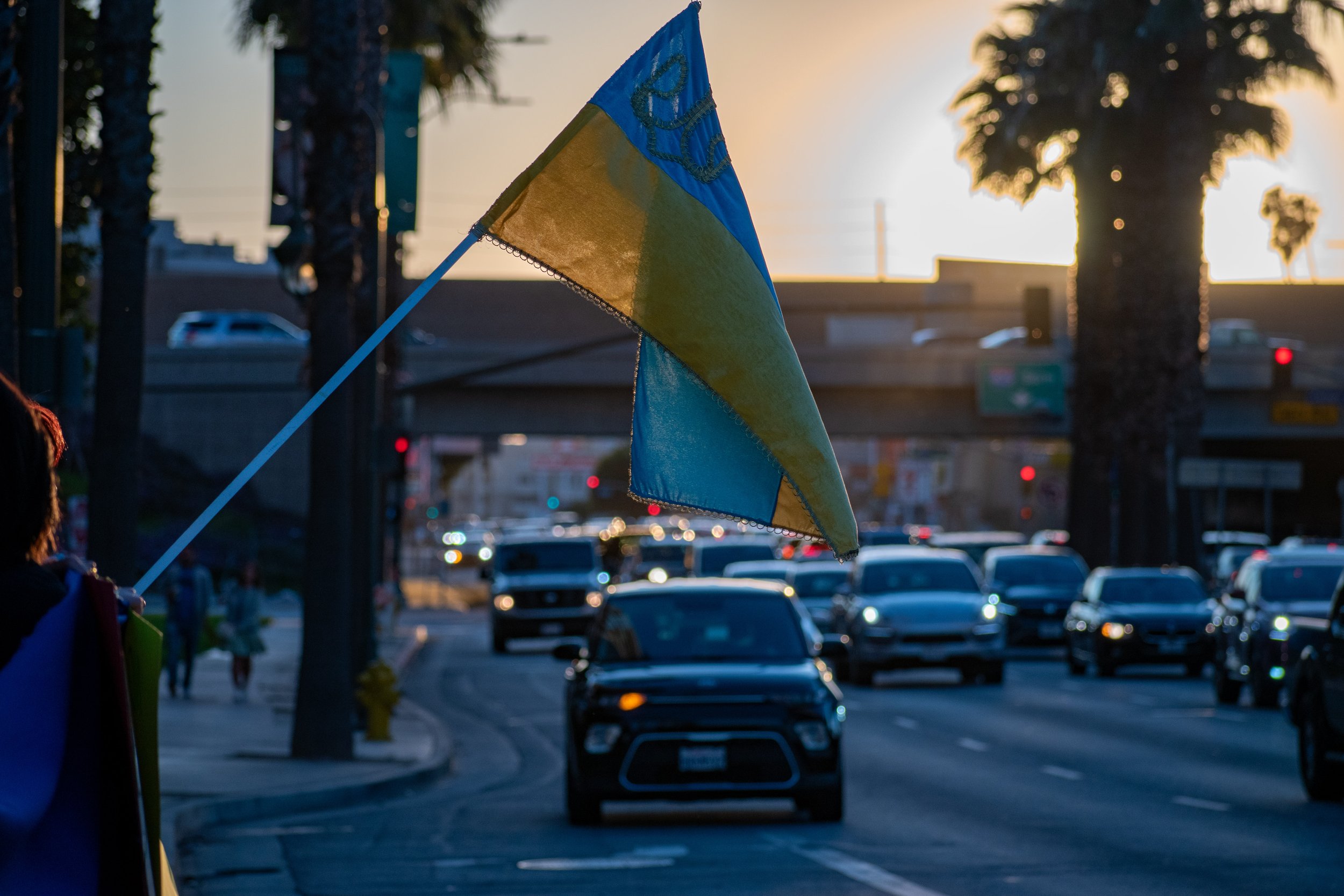  Pro-Ukrainian protestors wave a flag in support at 11111 Santa Monica Blvd in Santa Monica, Calif. on Feb. 26. Even far away from home, Ukrainian support is widespread, both among Ukrainians living abroad and other citizens. (Marc Federici | The Cor
