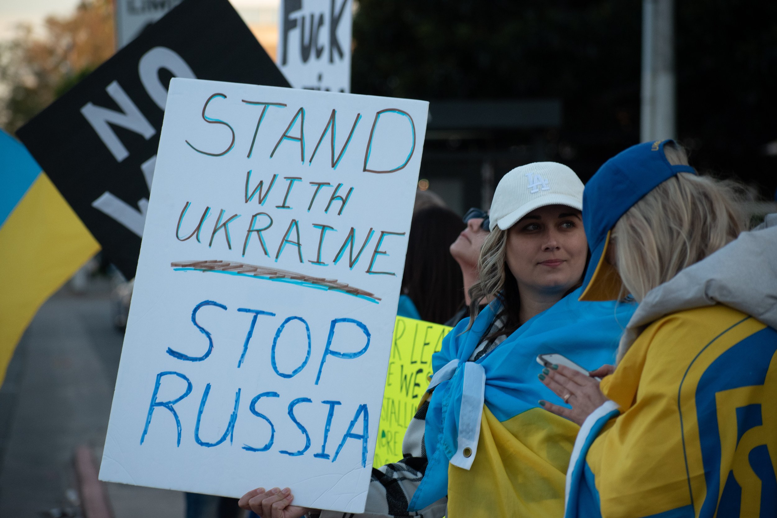  Pro-Ukrainian protestors hold signs into the street in support at 11111 Santa Monica Blvd in Santa Monica, Calif. on February 26, 2022. Even across the globe, anti-Russian invasion sentiment is tangibly felt, especially in Los Angeles ( Marc Federic