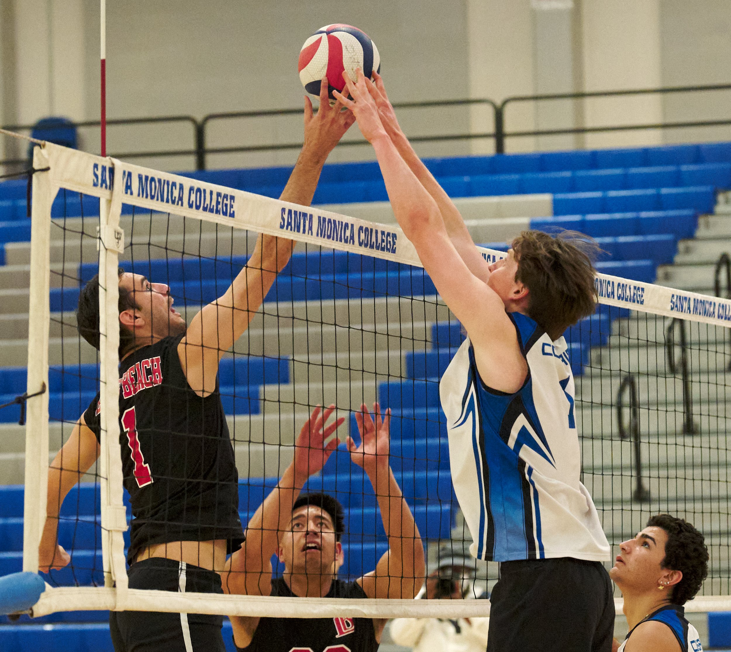  A joust between Joseph Rocha and Bryant Bardeau during the men's volleyball match between the Long Beach City College Vikings and the Santa Monica College Corsairs. Also pictured are Amery Leomiti for LBCC, and Sean Ortiz for SMC. (Nicholas McCall |